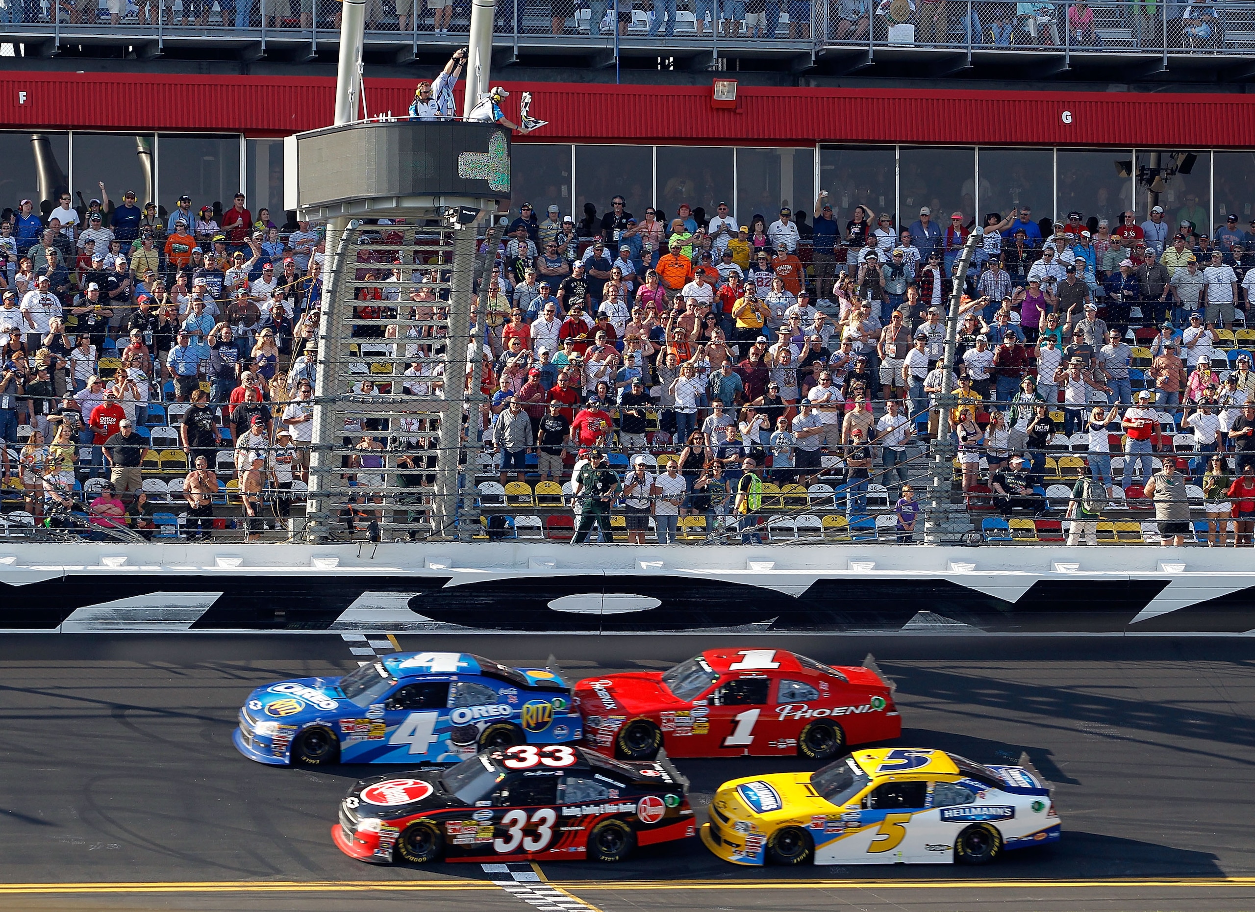 DAYTONA BEACH, FL - FEBRUARY 19:  Tony Stewart, driver of the #4 Oreo/Ritz Chevrolet, crosses the finish line ahead of Clint Bowyer, driver of the #33 Rheem Heating, Cooling & Water Heating Chevrolet, to win the NASCAR Nationwide Series DRIVE4COPD 300 at