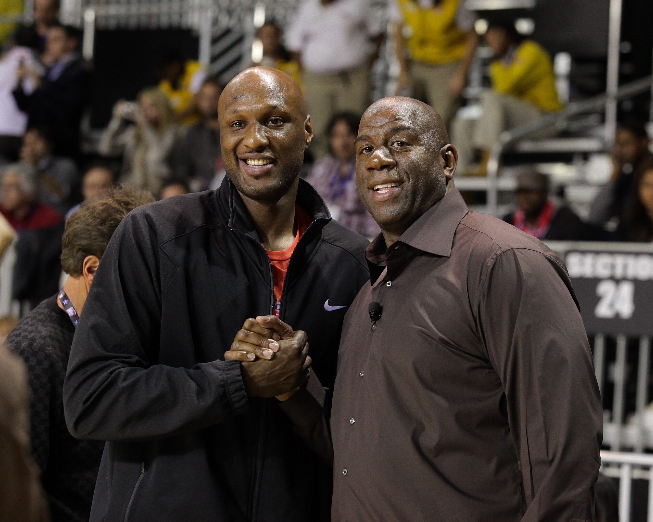 LOS ANGELES, CA - FEBRUARY 18:  Lamar Odom (L) and Magic Johnson attend the 2011 BBVA NBA All-Star Celebrity Game at the Los Angeles Convention Center on February 18, 2011 in Los Angeles, California.  (Photo by Noel Vasquez/Getty Images)