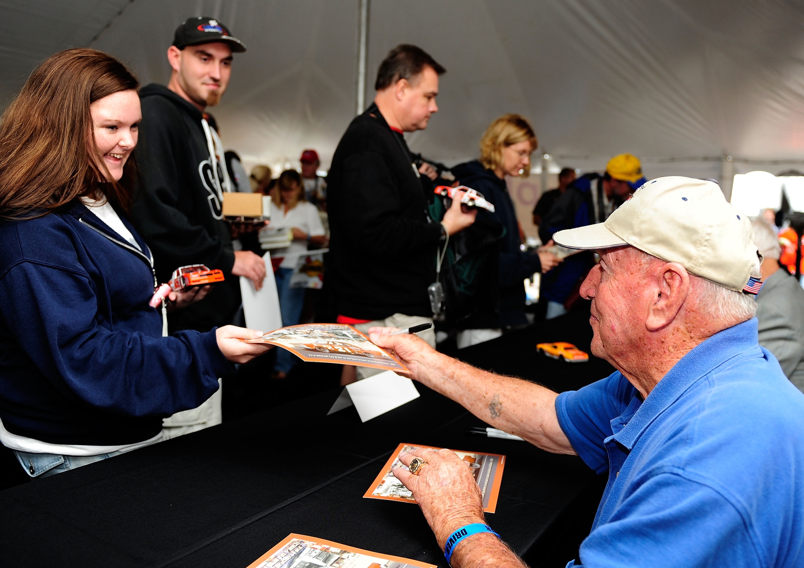 DARLINGTON, SC - SEPTEMBER 26:  NASCAR legend Marvin Panch signs autographs during the Darlington Historic Racing Festival on September 26, 2009 at Darlington Raceway in Darlington, South Carolina.  (Photo by Rusty Jarrett/Getty Images)