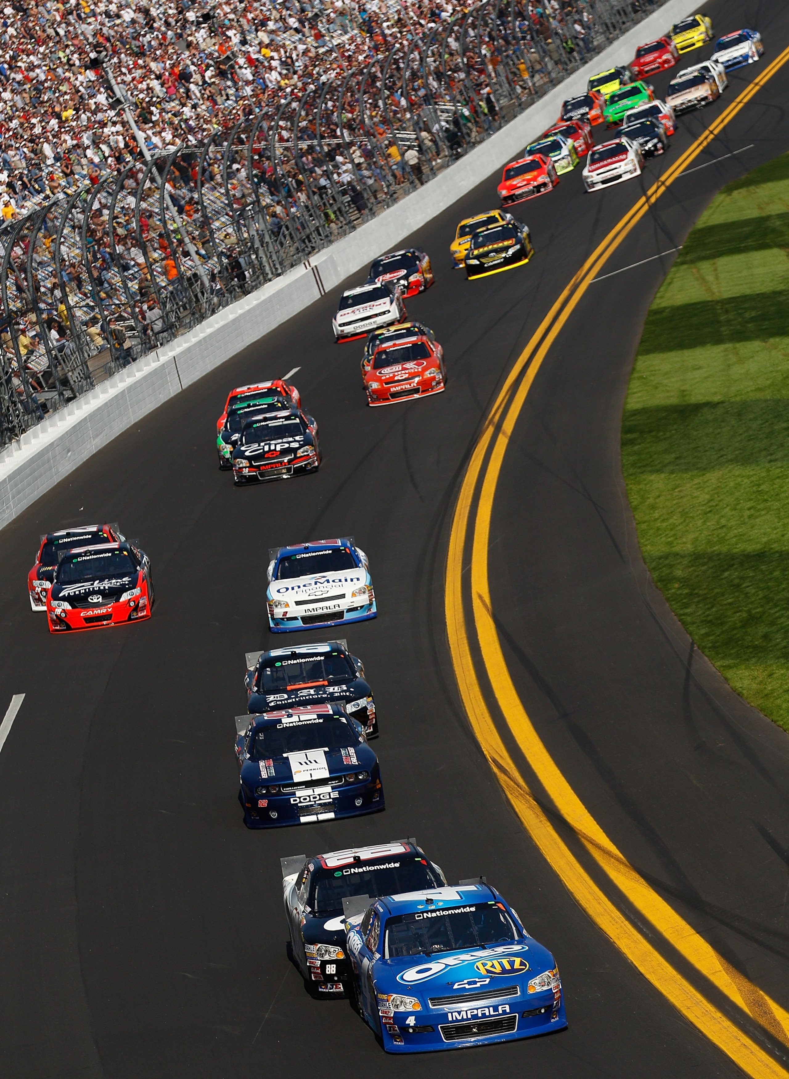 DAYTONA BEACH, FL - FEBRUARY 19:  Tony Stewart, driver of the #4 Oreo/Ritz Chevrolet, leads a pack of cars during the NASCAR Nationwide Series DRIVE4COPD 300 at Daytona International Speedway on February 19, 2011 in Daytona Beach, Florida.  (Photo by Chri