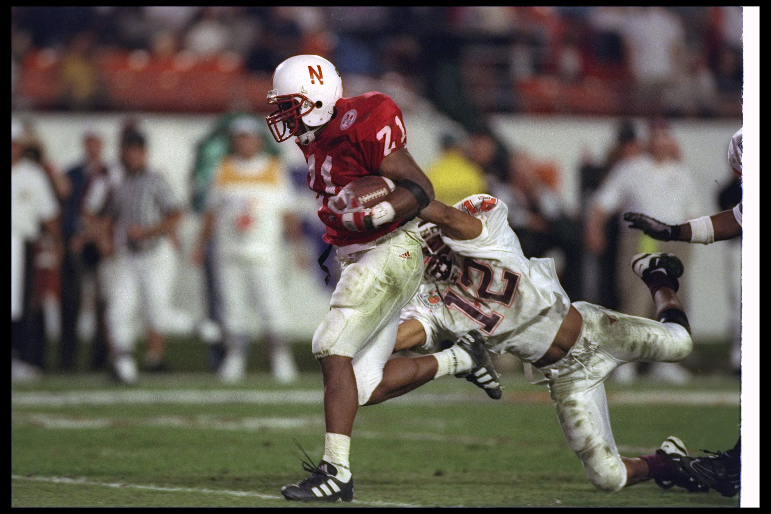 31 Dec 1996: Running back Damon Benning of the Nebraska Cornhuskers attempts to break the tackle of Virginia Tech Hokies defensive back Loren Johnson during the Orange Bowl at the Orange Bowl in Miami, Florida. Nebraska won the game, 41-21. Mandatory Cr 31 Dec 1996: Running back Damon Benning of the Nebraska Cornhuskers attempts to break the tackle of Virginia Tech Hokies defensive back Loren Johnson during the Orange Bowl at the Orange Bowl in Miami, Florida. Nebraska won the game, 41-21. Mandatory Cr