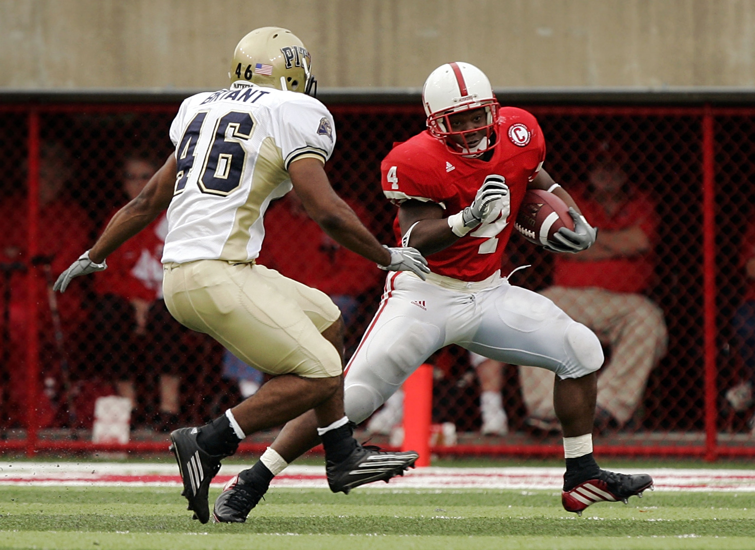 LINCOLN, NE - SEPTEMBER 17: Running back Corey Ross #4 of the Nebraska Cornhuskers dodges Sam Bryant #46 of the Pittsburgh Panthers on September 17, 2005 at Memorial Stadium in Lincoln, Nebraska. Nebraska won 7-6. (Photo by Brian Bahr/Getty Images) LINCOLN, NE - SEPTEMBER 17: Running back Corey Ross #4 of the Nebraska Cornhuskers dodges Sam Bryant #46 of the Pittsburgh Panthers on September 17, 2005 at Memorial Stadium in Lincoln, Nebraska. Nebraska won 7-6. (Photo by Brian Bahr/Getty Images)