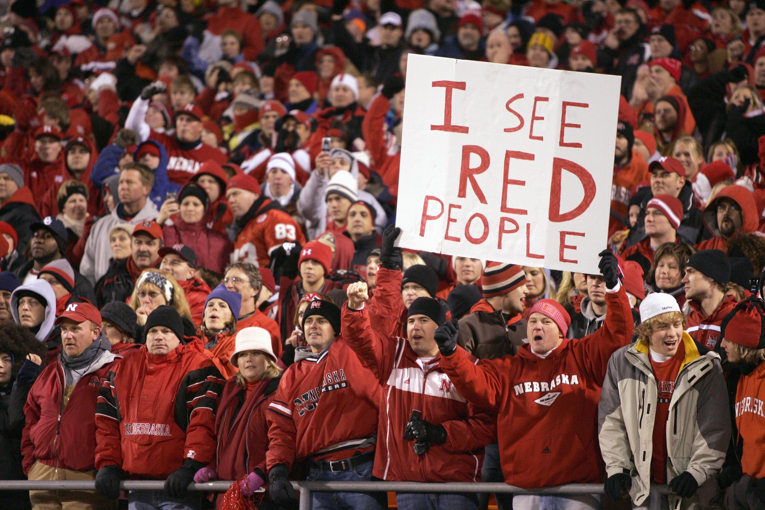 KANSAS CITY, MO - DECEMBER 2: Fans of the Oklahoma Sooners cheer against the Nebraska Cornhuskers during the 2006 Dr. Pepper Big 12 Championship on December 2, 2006 at Arrowhead Stadium in Kansas City, Missouri. The Sooners won 21-7. (Photo by Brian Bahr/ KANSAS CITY, MO - DECEMBER 2: Fans of the Oklahoma Sooners cheer against the Nebraska Cornhuskers during the 2006 Dr. Pepper Big 12 Championship on December 2, 2006 at Arrowhead Stadium in Kansas City, Missouri. The Sooners won 21-7. (Photo by Brian Bahr/