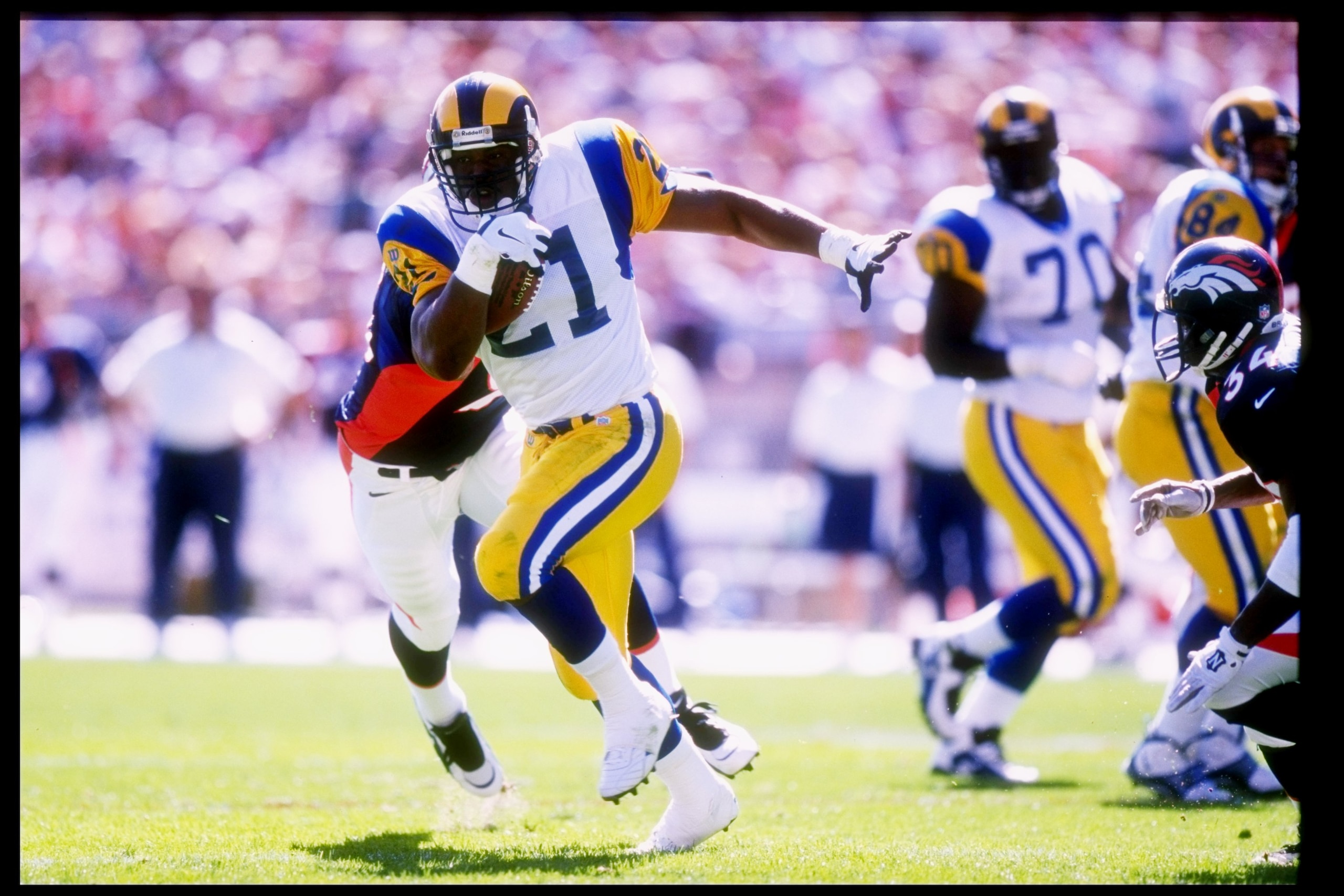 14 Sep 1997: Running back Lawrence Phillips #21 of the St Louis Rams in action during a game against the Denver Broncos at Mile High Stadium in Denver, Colorado. The Broncos won the game 35-14. Mandatory Credit: Brian Bahr /Allsport 14 Sep 1997: Running back Lawrence Phillips #21 of the St Louis Rams in action during a game against the Denver Broncos at Mile High Stadium in Denver, Colorado. The Broncos won the game 35-14. Mandatory Credit: Brian Bahr /Allsport