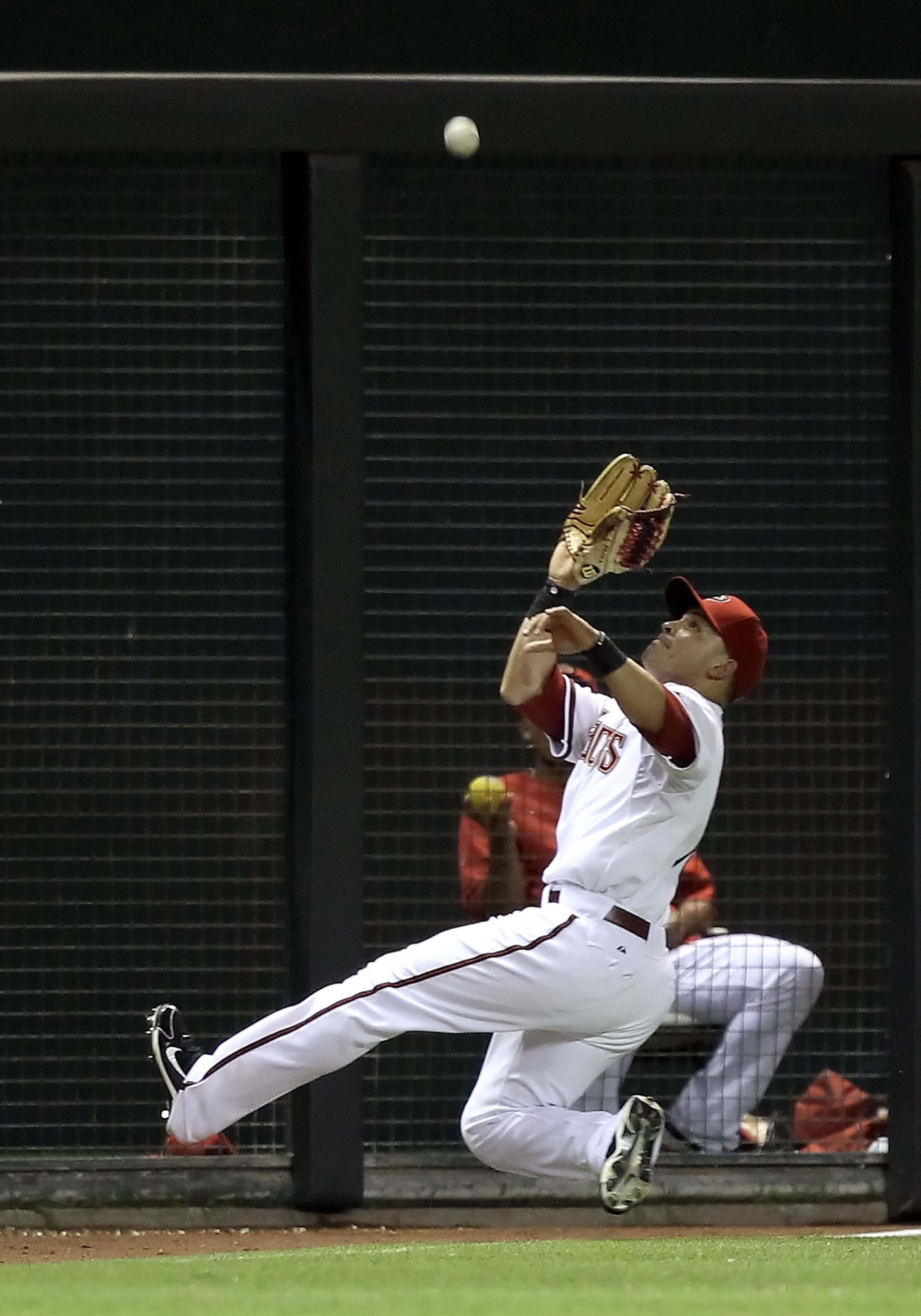 PHOENIX - JULY 19:  Outfielder Gerardo Parra #18 of the Arizona Diamondbacks makes a leaping catch for an out againt the New York Mets during the fourth inning of the Major League Baseball game at Chase Field on July 19, 2010 in Phoenix, Arizona.  (Photo