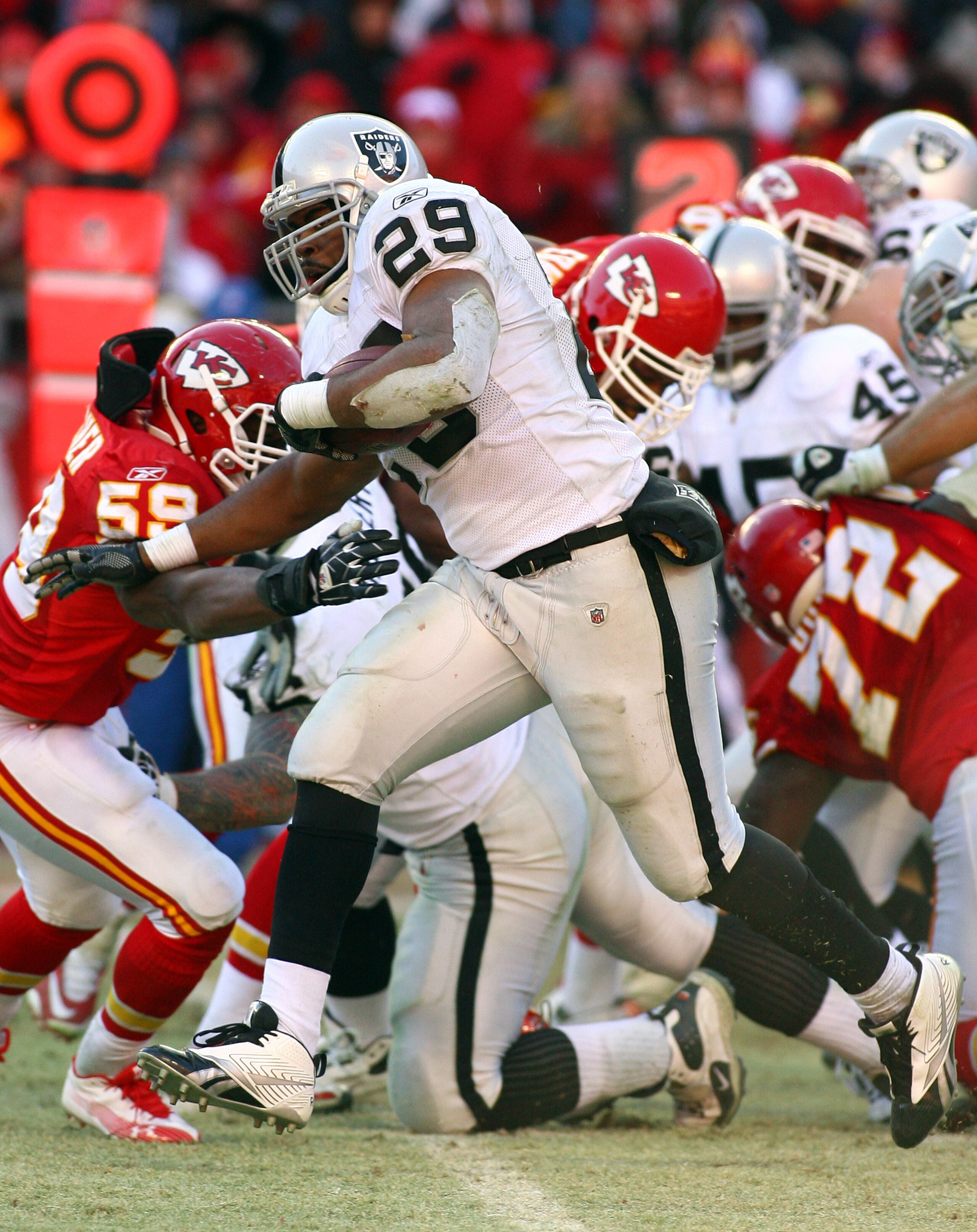 KANSAS CITY, MO - JANUARY 02:  Running back Michael Bush #29 of the Oakland Raiders runs down field in a game against the Kansas City Chiefs at Arrowhead Stadium on January 2, 2011 in Kansas City, Missouri.  (Photo by Tim Umphrey/Getty Images)