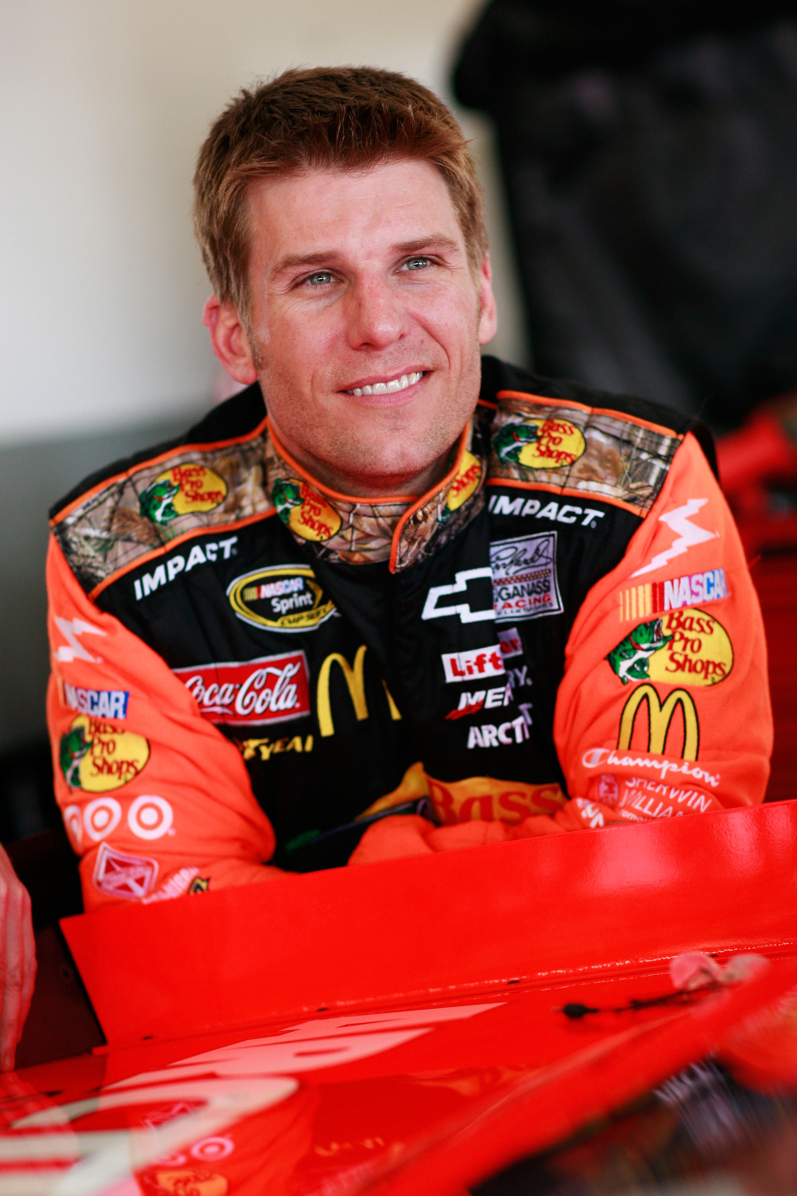 DAYTONA BEACH, FL - FEBRUARY 16:  Jamie McMurray, driver of the #1 Bass Pro Shops Chevrolet, looks on in the garage area during practice for the NASCAR Sprint Cup Series Daytona 500 at Daytona International Speedway on February 16, 2011 in Daytona Beach,