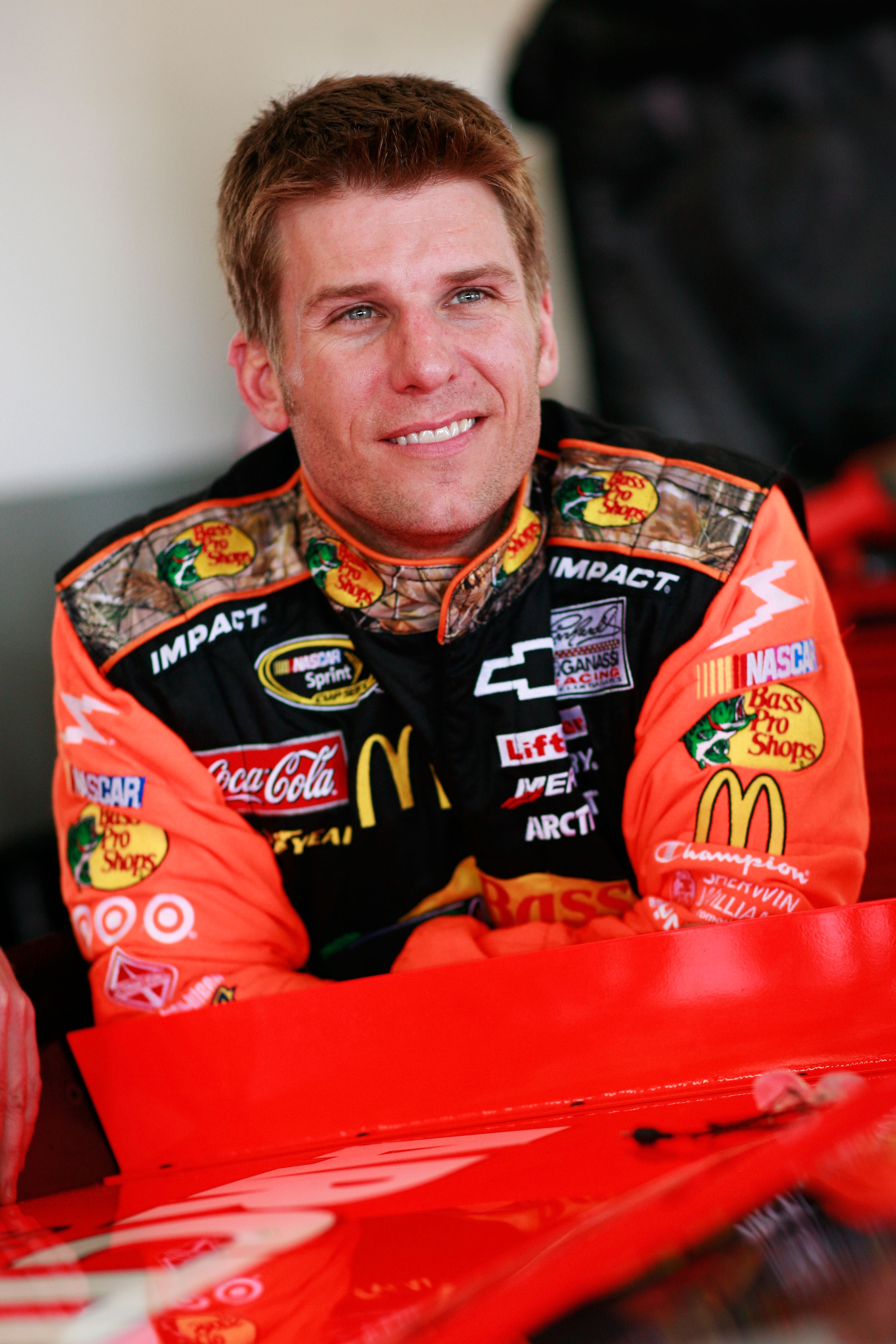 DAYTONA BEACH, FL - FEBRUARY 16:  Jamie McMurray, driver of the #1 Bass Pro Shops Chevrolet, looks on in the garage area during practice for the NASCAR Sprint Cup Series Daytona 500 at Daytona International Speedway on February 16, 2011 in Daytona Beach,