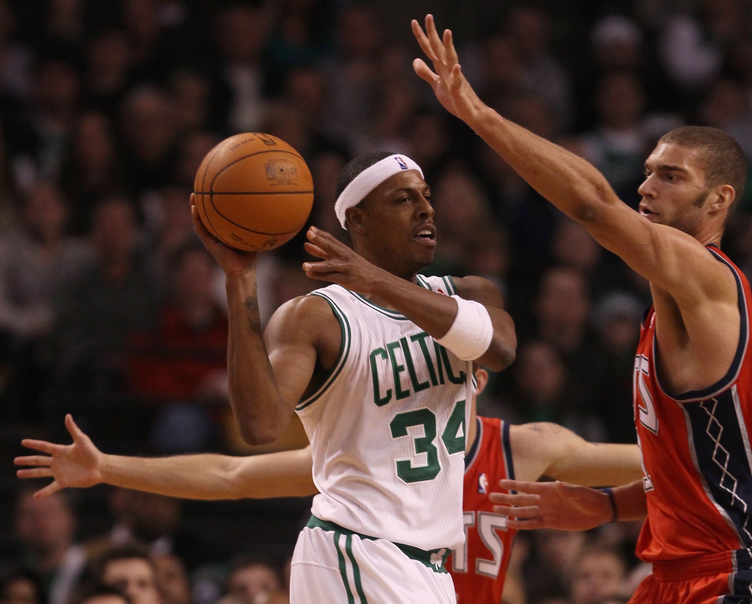 BOSTON - NOVEMBER 24:  Paul Pierce #34 of the Boston Celtics tries to pass around Brook Lopez #11 of the New Jersey Nets on November 24, 2010 at the TD Garden in Boston, Massachusetts. The Celtics defeated the nets 89-83. NOTE TO USER: User expressly ackn