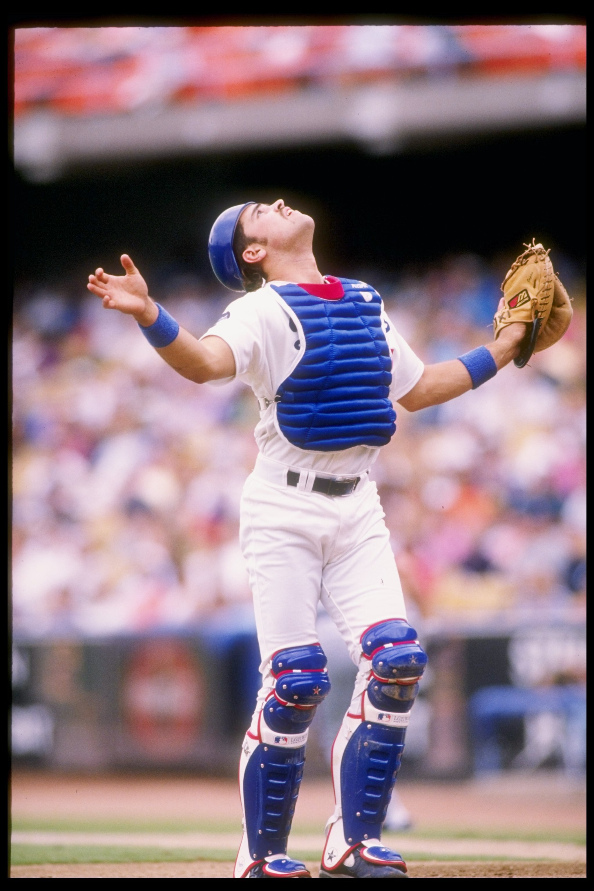 25 Jul 1993:  Catcher Mike Piazza of the Los Angeles Dodgers looks to catch the ball during a game against the New York Mets at Dodger Stadium in Los Angeles, California. Mandatory Credit: Stephen Dunn  /Allsport