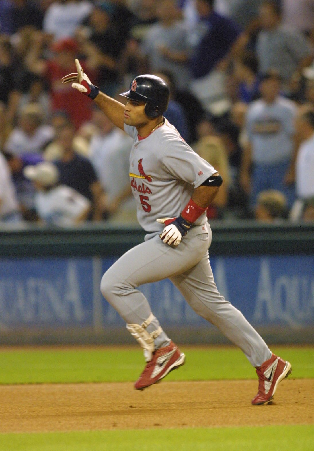 10 Oct 2001:  Albert Pujols of the St. Louis Cardinals celebrates after hitting a home run against Randy Johnson of the Arizona Diamondbacks during Game 2 of the National League Western Divisional Series at Bank One Ballpark in Phoenix, Arizona. DIGITAL I