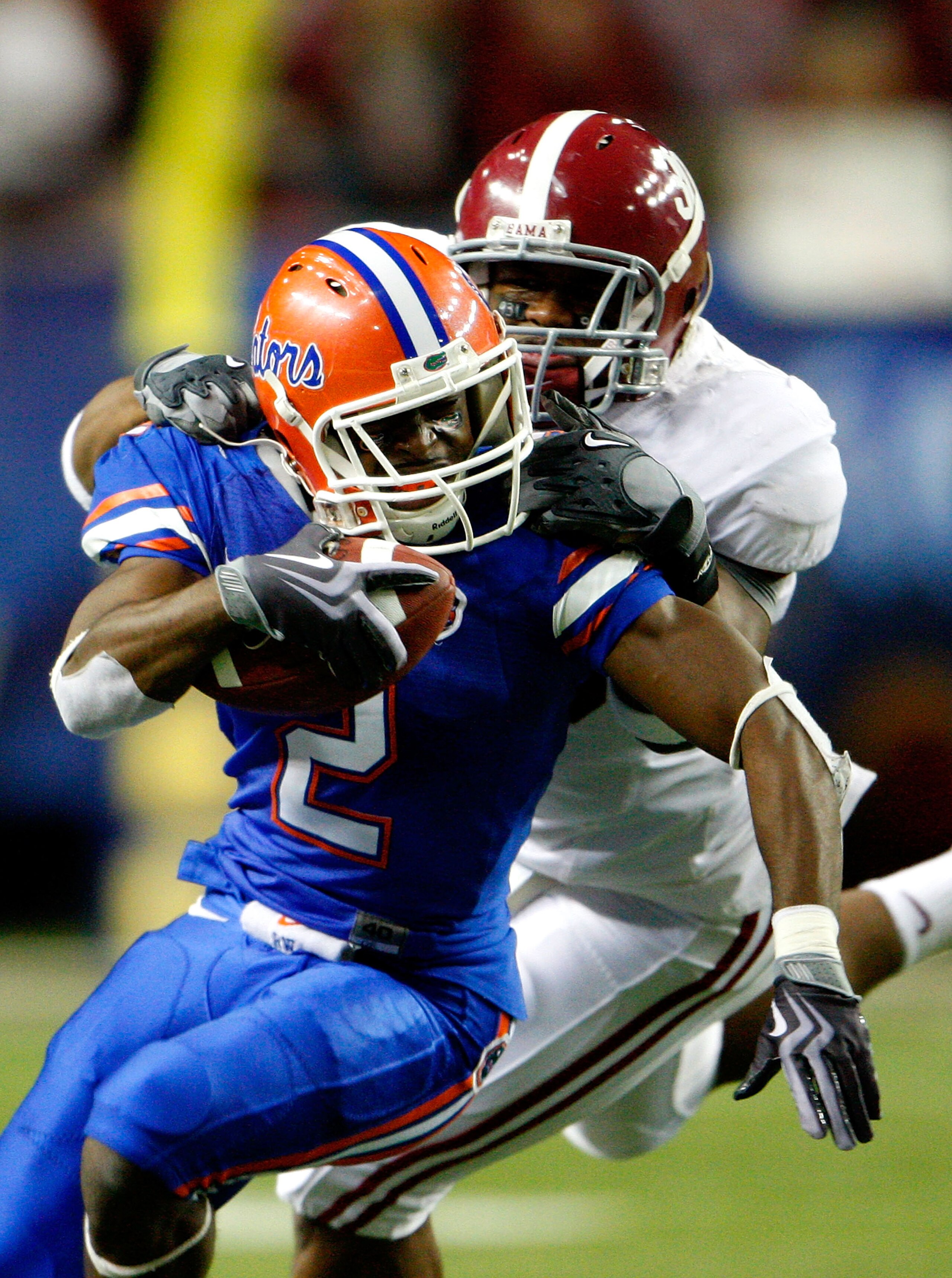 ATLANTA - DECEMBER 06:  Dont'a Hightower #30 of the Alabama Crimson Tide is penalized for a facemask as he tackles Jeffery Demps #2 of the Florida Gators during the SEC Championship on December 6, 2008 at the Georgia Dome in Atlanta, Georgia.  (Photo by K