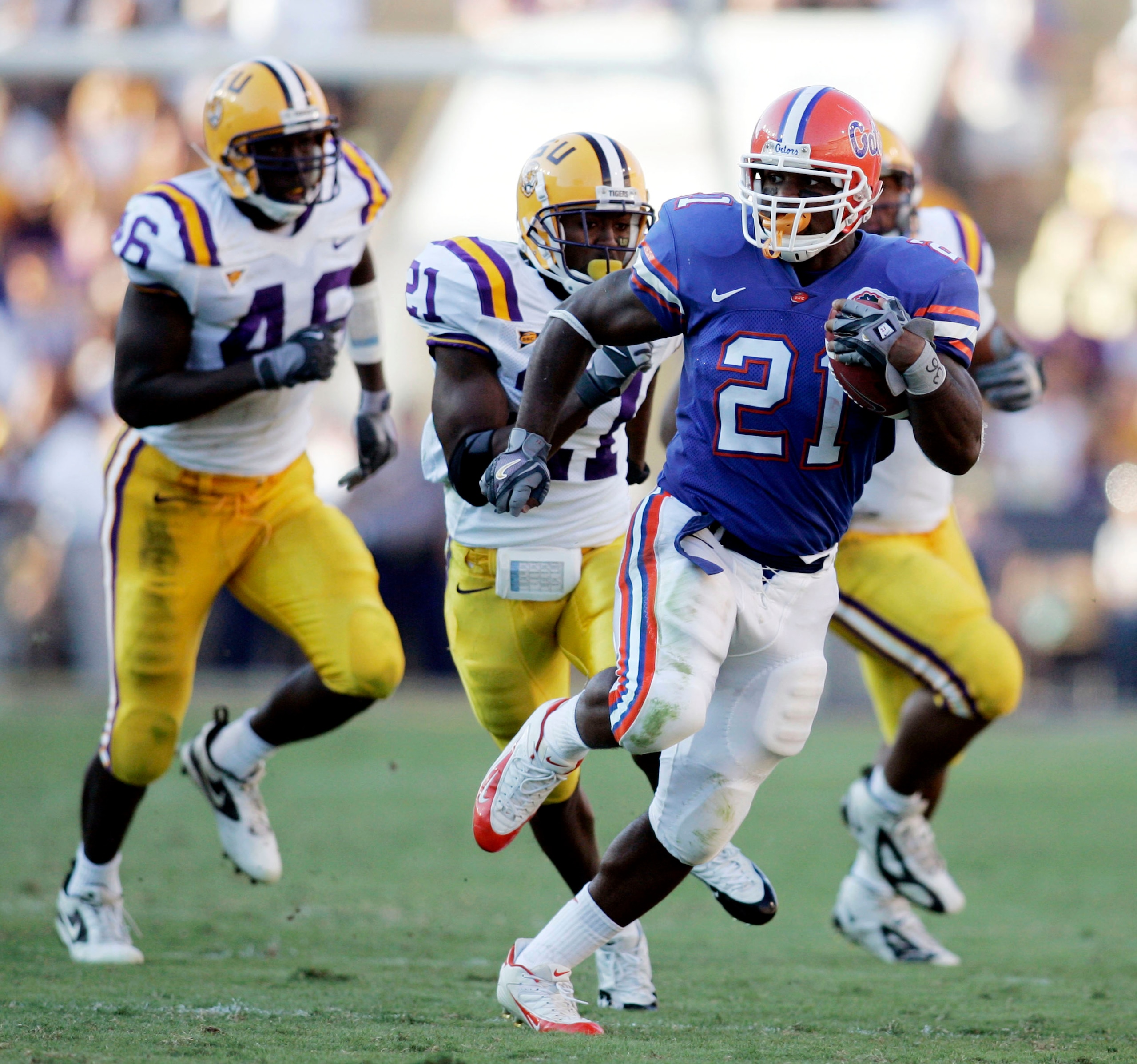 BATON ROUGE, LA - OCTOBER 15:  DeShawn Wynn #21 of the University of Florida is chased by members of the Louisiana State University defense at Tiger Stadium in Baton Rouge, Louisiana on October 15, 2005. LSU defeated the University of Florida 21-17.  (Pho