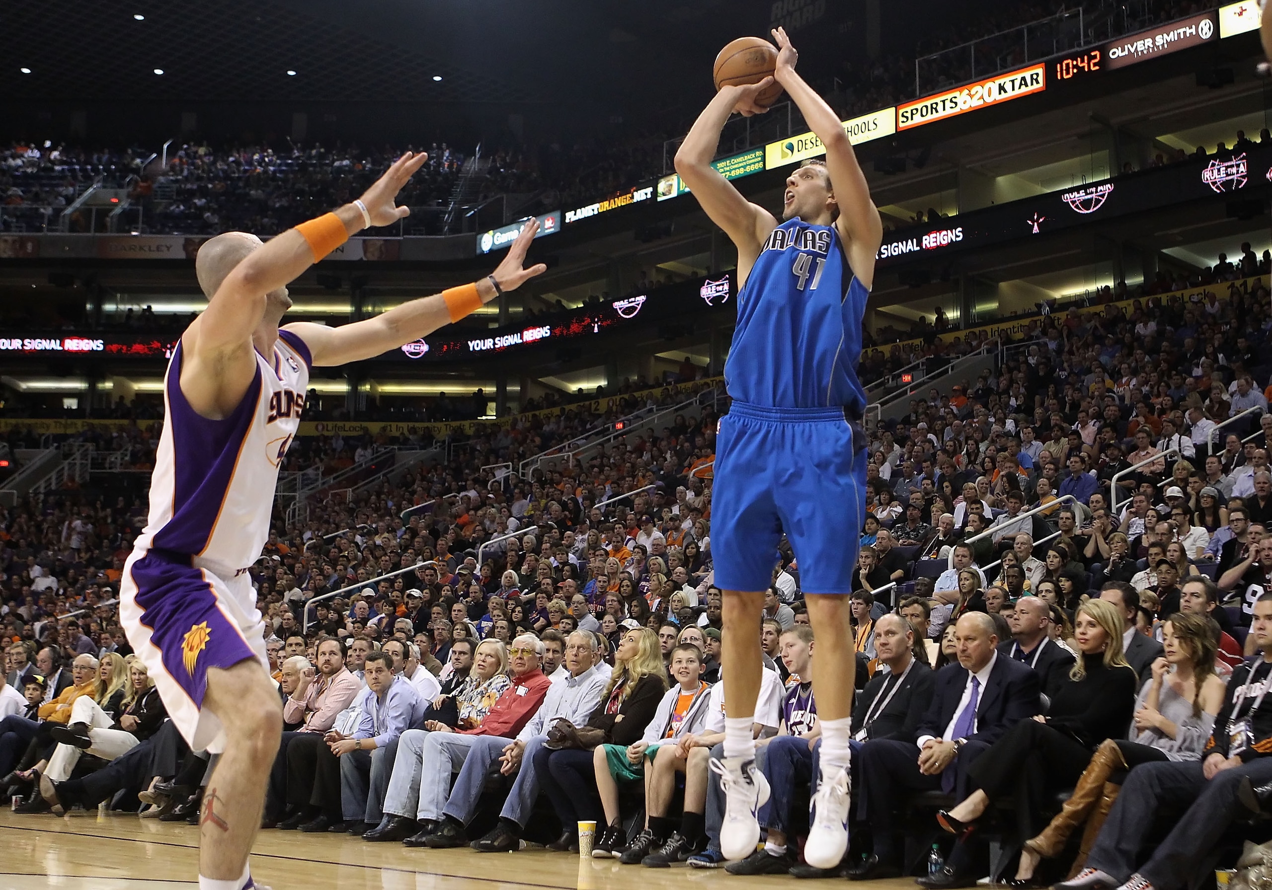 PHOENIX, AZ - FEBRUARY 17:  Dirk Nowitzki #41 of the Dallas Mavericks puts up a three point shot against the Phoenix Suns during the NBA game at US Airways Center on February 17, 2011 in Phoenix, Arizona.  The Mavericks defeated the Suns 112-106. NOTE TO