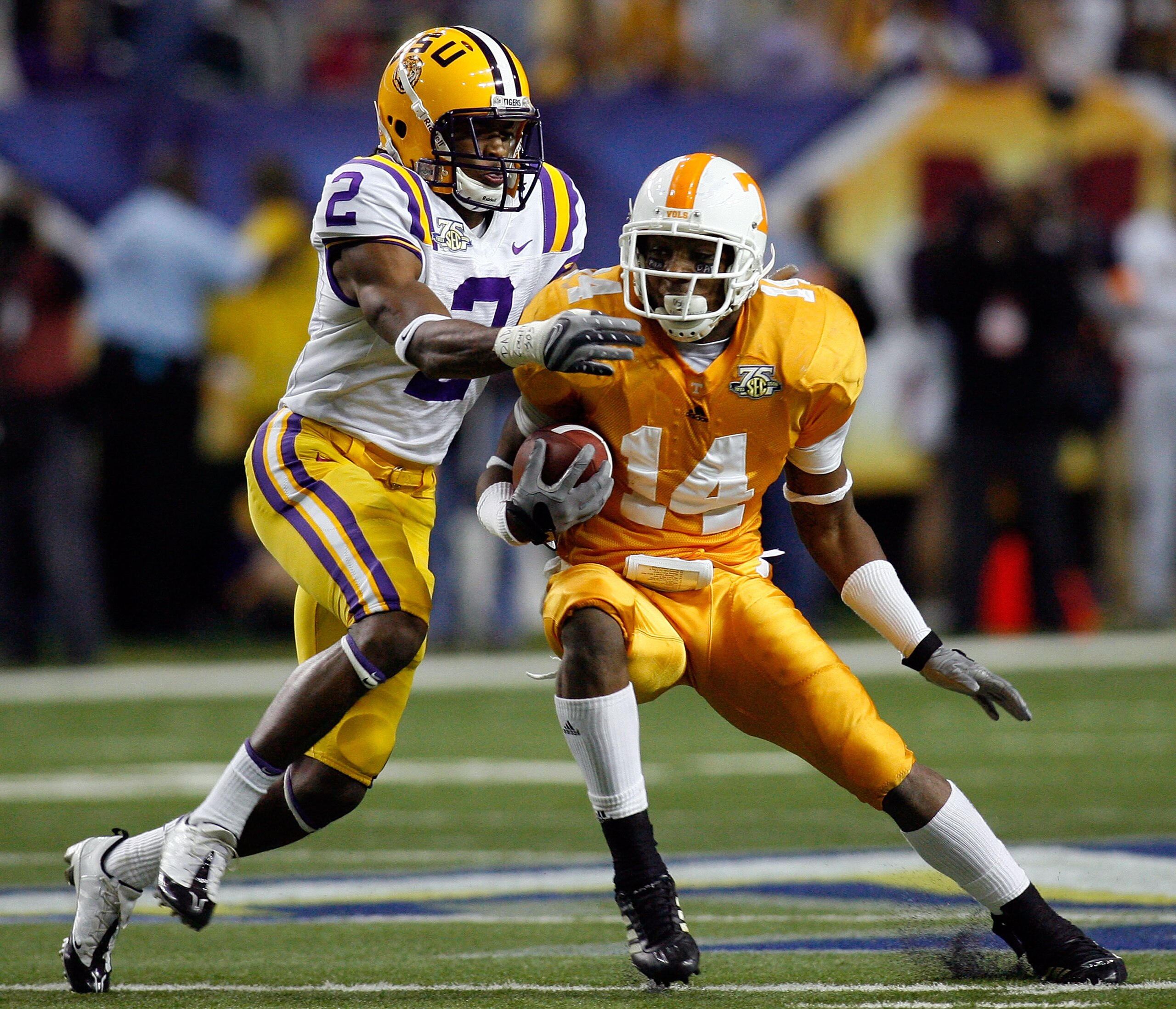 ATLANTA - DECEMBER 01:  Eric Berry #14 of the University of Tennessee Volunteers is tackled after an interception by Demetrius Byrd #2 of the Louisiana State University Tigers during the SEC Championship game on December 1, 2007 at the Georgia Dome in Atl
