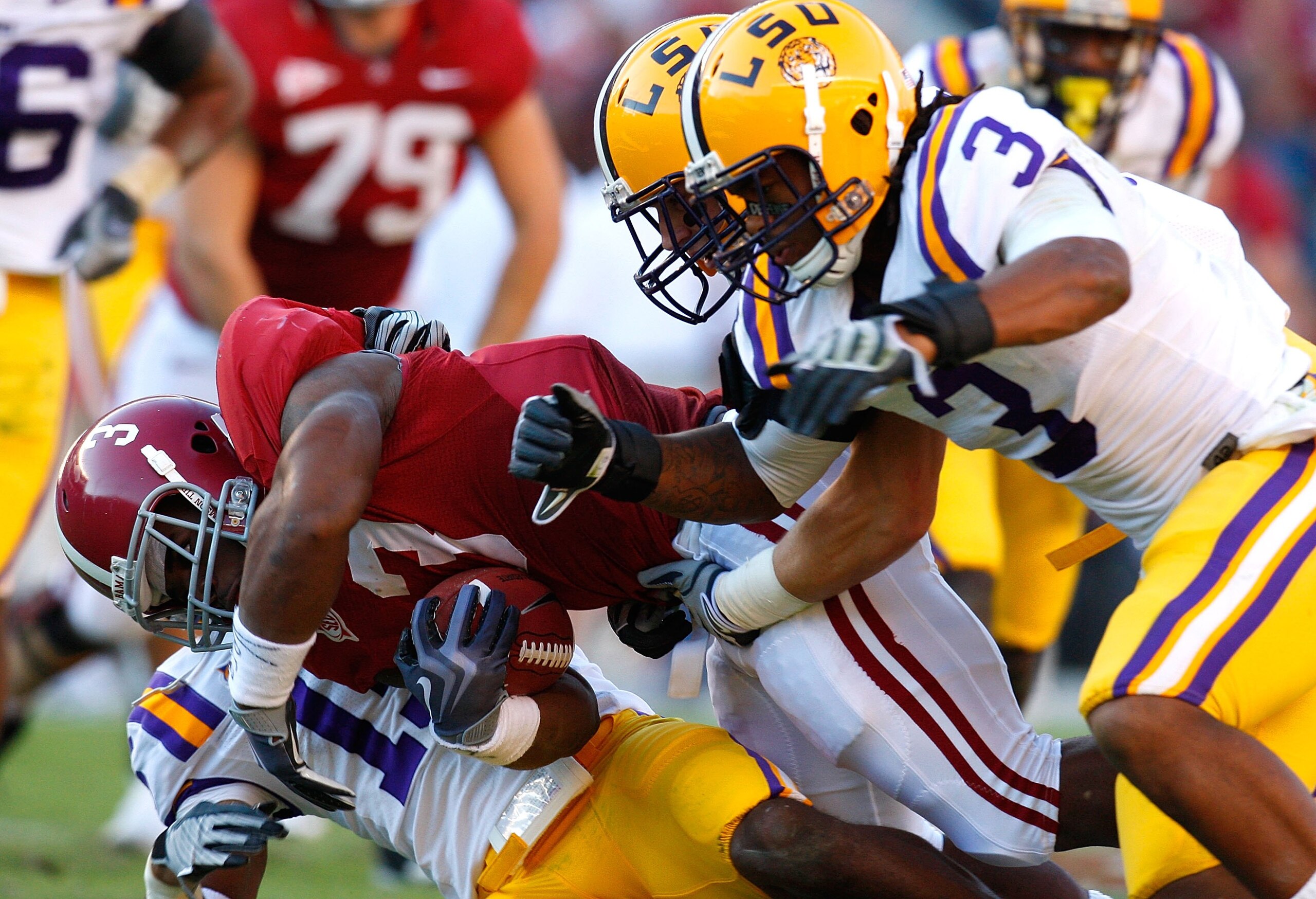 TUSCALOOSA, AL - NOVEMBER 07:  Trent Richardson #3 of the Alabama Crimson Tide rushes upfield against Chad Jones #3 of the Louisiana State University Tigers at Bryant-Denny Stadium on November 7, 2009 in Tuscaloosa, Alabama.  (Photo by Kevin C. Cox/Getty