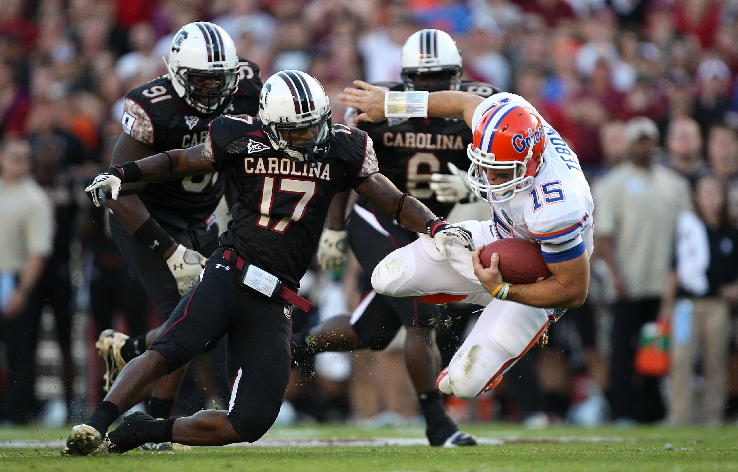 COLUMBIA, SC - NOVEMBER 14:  Tim Tebow #15 of the Florida Gators is tackled by Chris Culliver #17 of the South Carolina Gamecocks during their game at Williams-Brice Stadium on November 14, 2009 in Columbia, South Carolina.  (Photo by Streeter Lecka/Getty