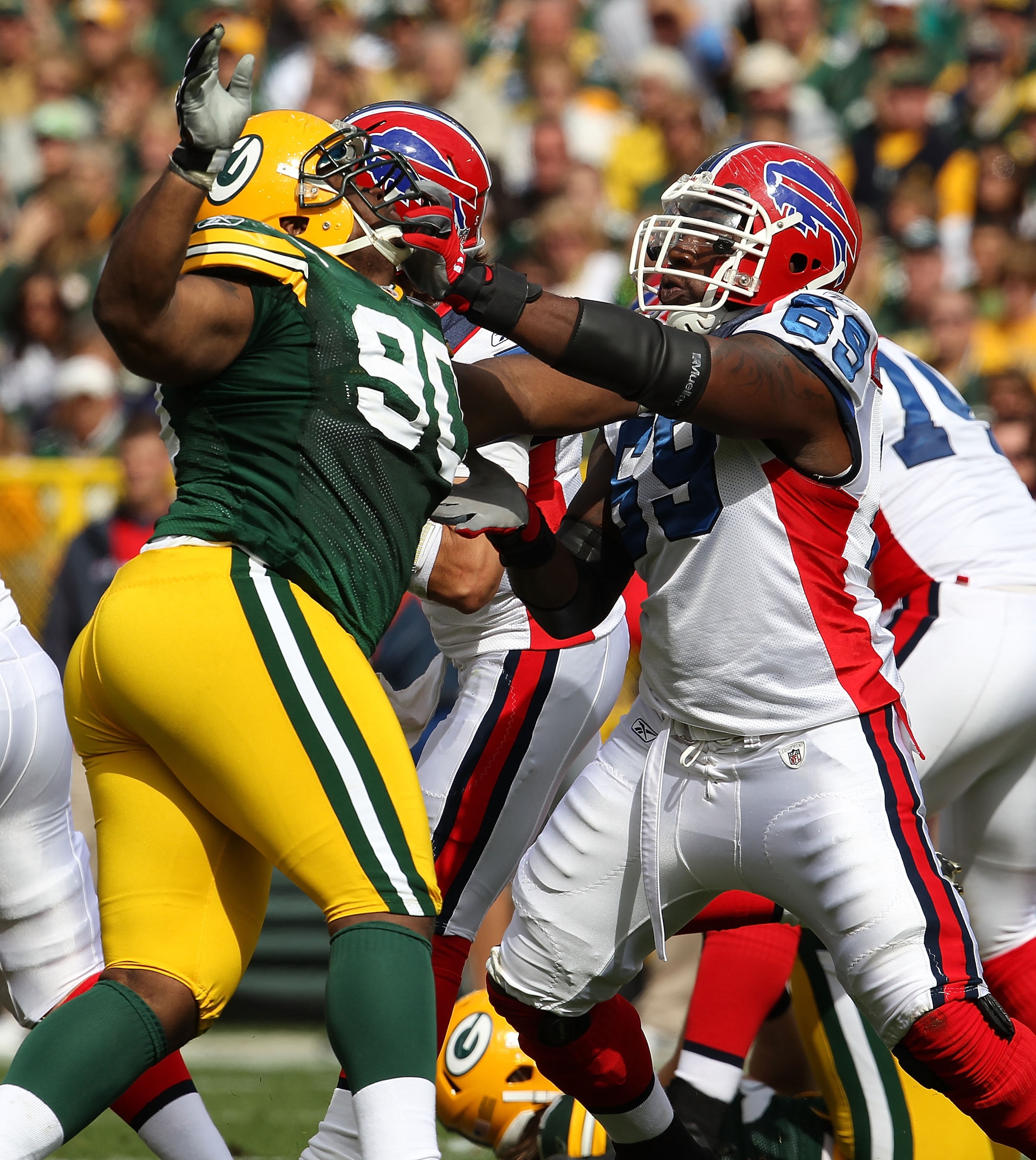 GREEN BAY, WI - SEPTEMBER 19: Jamon Meredith #69 of the Buffalo Bills blocks B.J. Raji #90 of the Green Bay Packers at Lambeau Field on September 19, 2010 in Green Bay, Wisconsin. The Packers defeated the Bills 34-7. (Photo by Jonathan Daniel/Getty Images