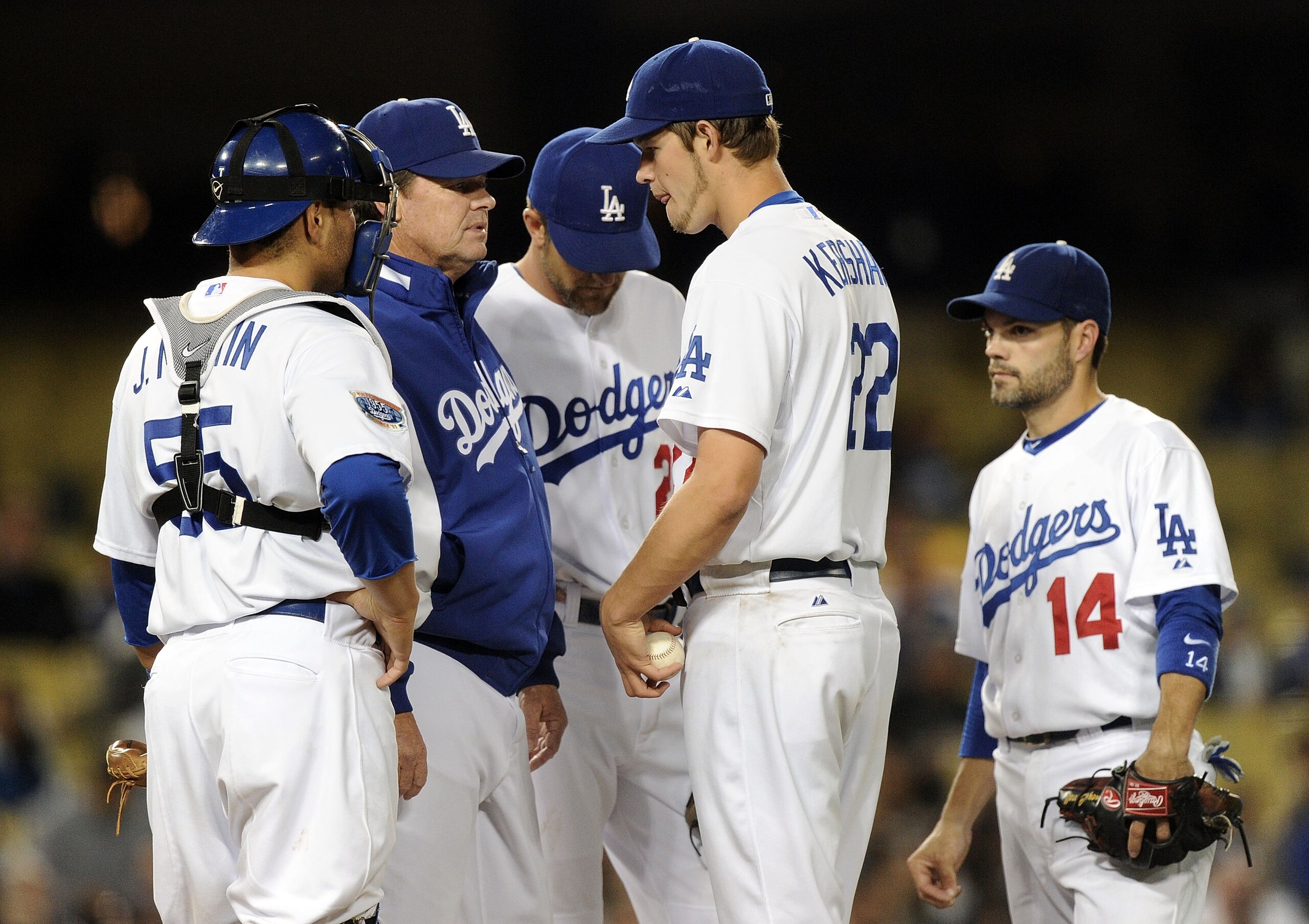 LOS ANGELES, CA - MAY 20:  Clayton Kershaw #22 of the Los Angeles Dodgers receives a visit to the mound from pitching coach Rick Honeycutt #40 and teammates against the San Diego Padres during the fifth inning at Dodger Stadium on May 20, 2010 in Los Ange
