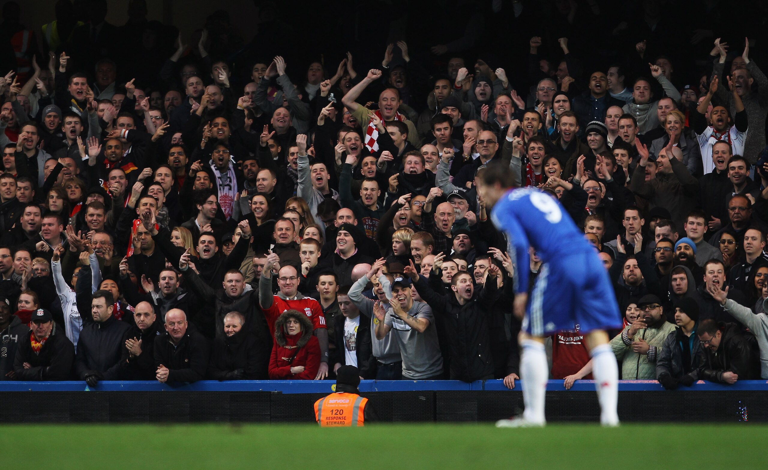 LONDON, ENGLAND - FEBRUARY 06:  Liverpool fans gestures towards Fernando Torres of Chelsea during the Barclays Premier League match between Chelsea and Liverpool at Stamford Bridge on February 6, 2011 in London, England.  (Photo by Scott Heavey/Getty Imag