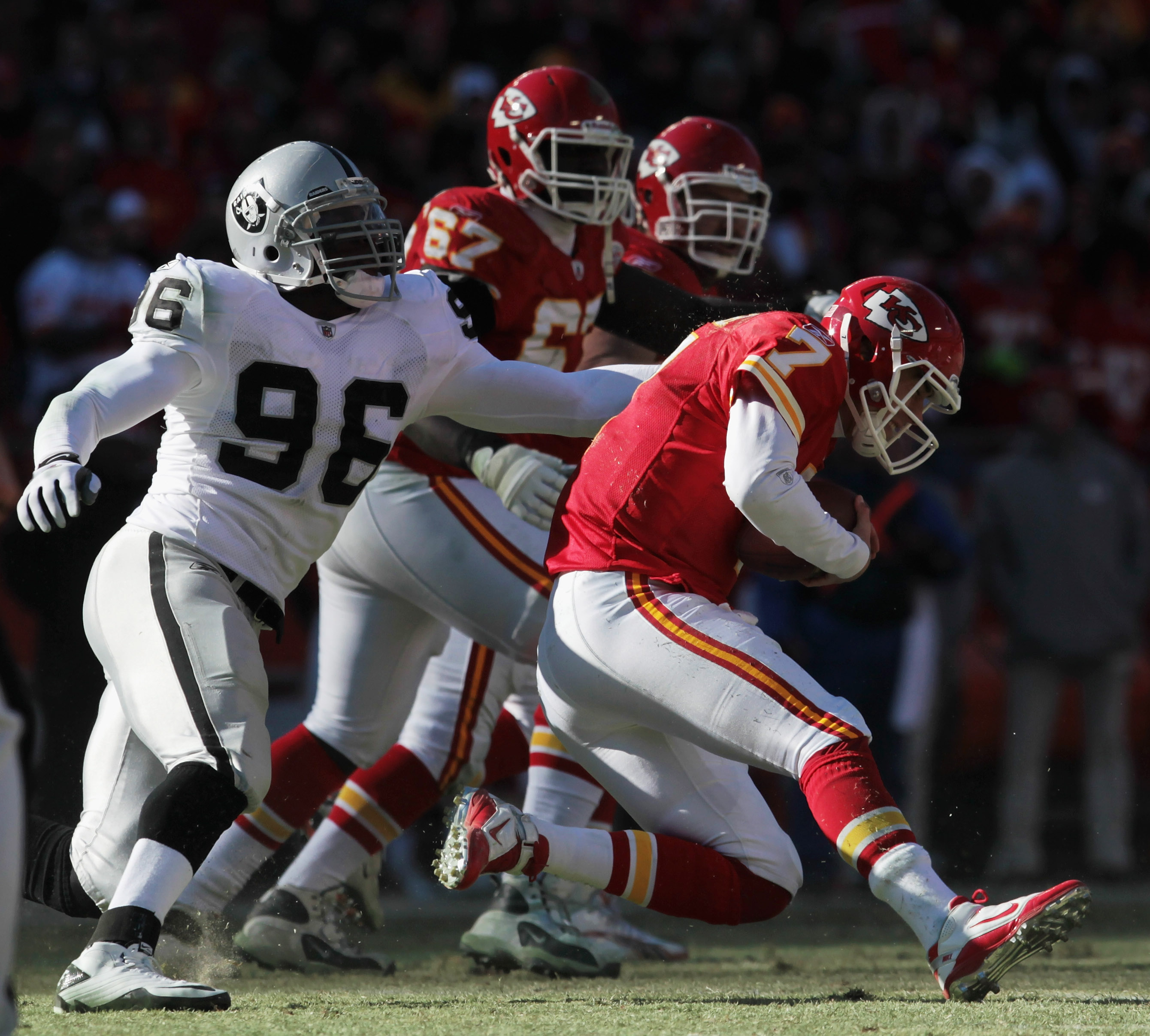 KANSAS CITY, MO - JANUARY 02:  Quarterback Matt Cassel #7 of the Kansas City Chiefs is sacked by Kamerion Wimbley #96 of the Oakland Raiders during the game on January 2, 2011 at Arrowhead Stadium in Kansas City, Missouri.  (Photo by Jamie Squire/Getty Im