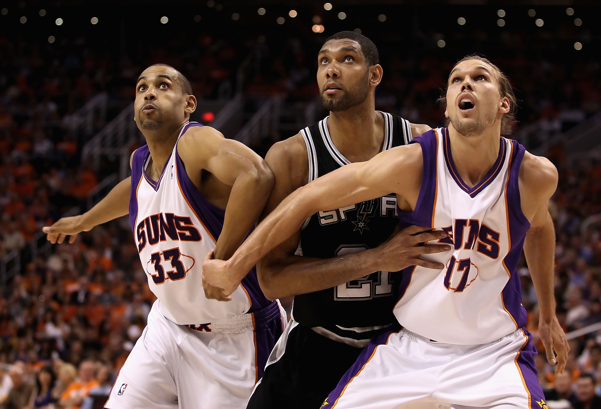 PHOENIX - MAY 03:  Grant Hill #33 and Louis Amundson #17 of the Phoenix Suns guard against Tim Duncan #21 of the San Antonio Spurs during Game One of the Western Conference Semifinals of the 2010 NBA Playoffs at US Airways Center on May 3, 2010 in Phoenix