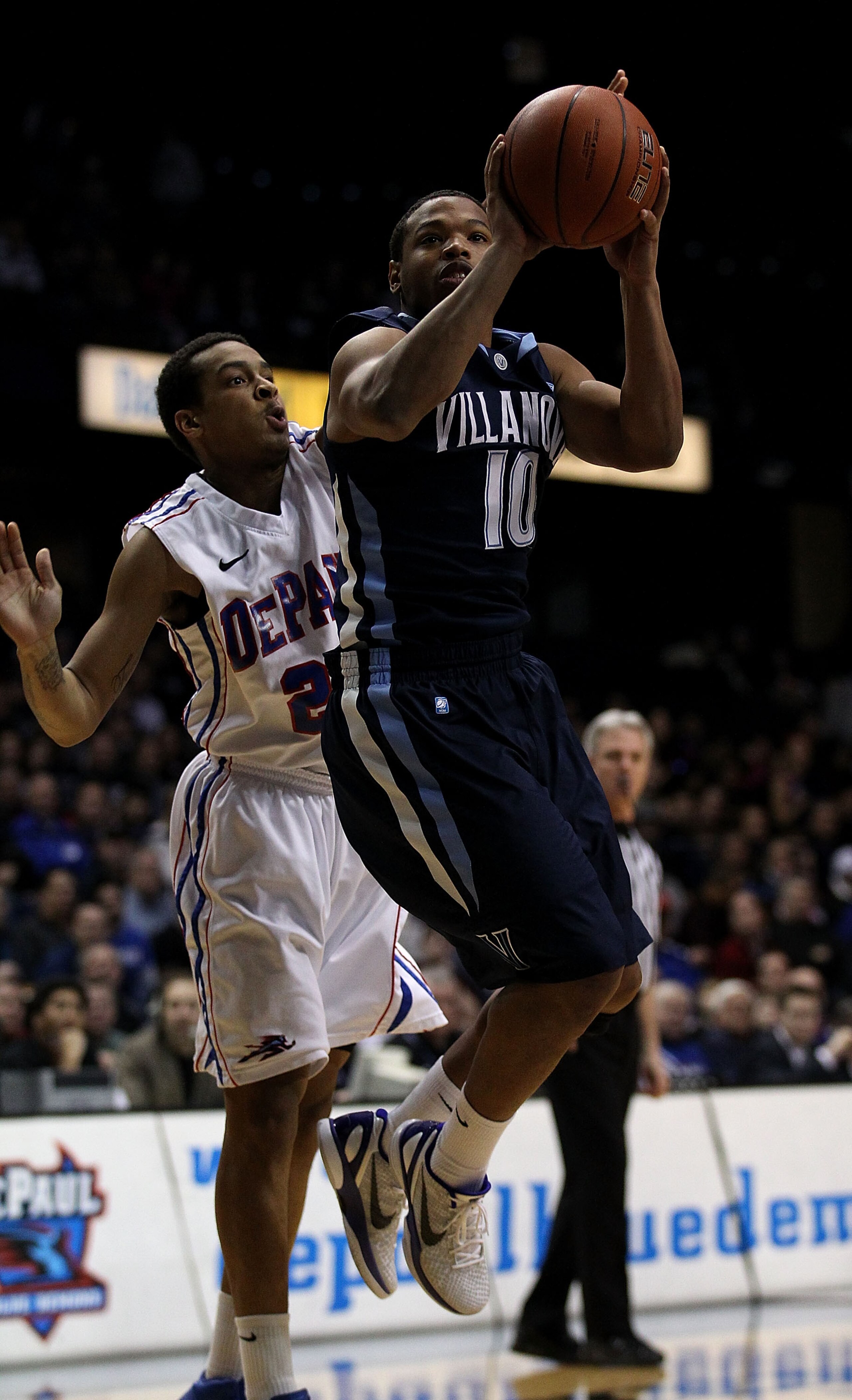 ROSEMONT, IL - FEBRUARY 19: Corey Fisher #10 of the Villanova Wildcats shoots under pressure from Brandon Young #20 of the DePaul Blue Demons at the Allstate Arena on February 19, 2011 in Rosemont, Illinois. (Photo by Jonathan Daniel/Getty Images)