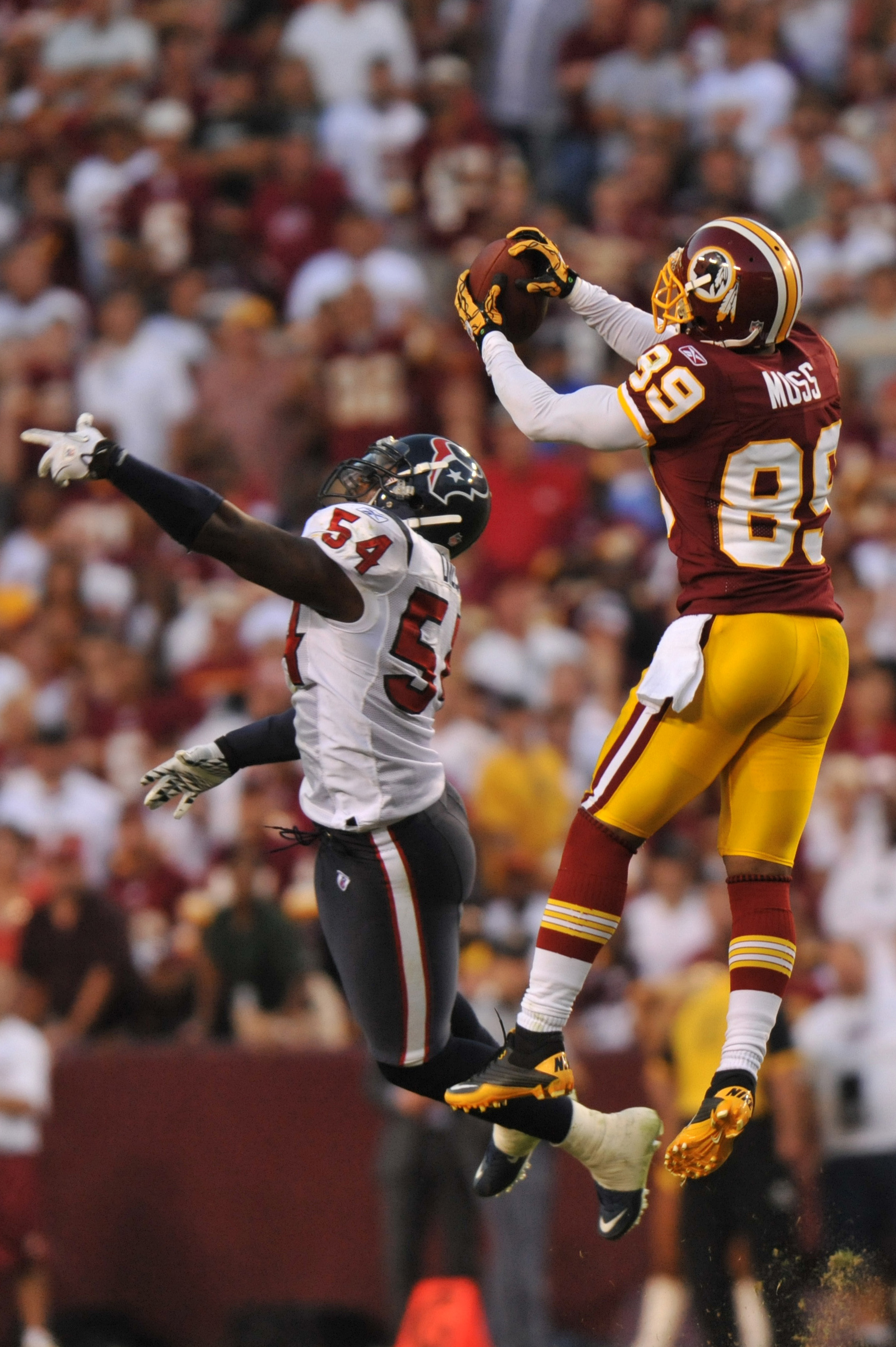 LANDOVER, MD - SEPTEMBER 19:  Santana Moss #89 of the Washington Redskins makes a catch against the Houston Texans at FedExField on September 19, 2010 in Landover, Maryland. The Texans defeated the Redskins in overtime 30-27. (Photo by Larry French/Getty