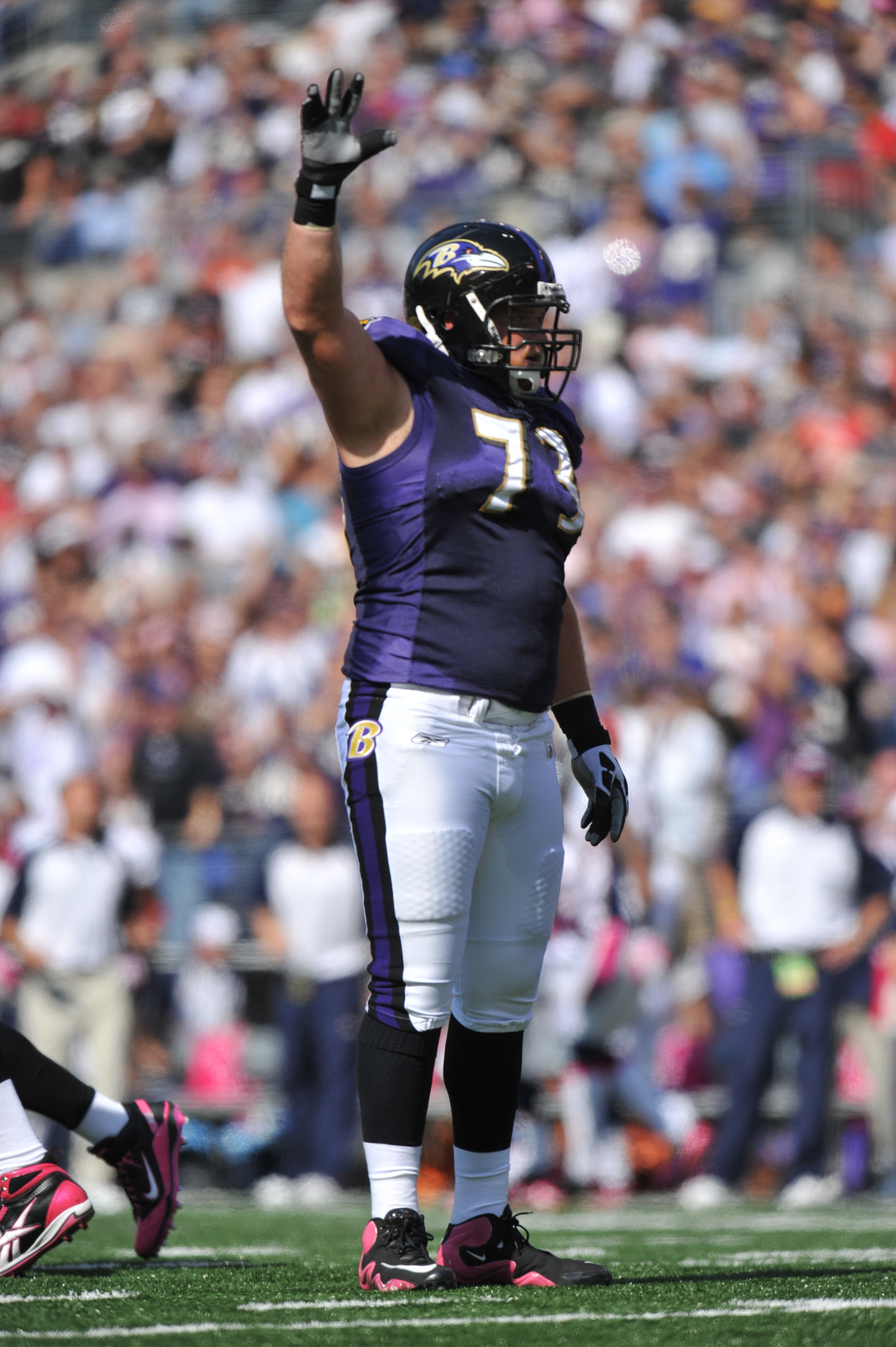 BALTIMORE, MD - OCTOBER 10: Marshal Yanda #73 of the Baltimore Ravens waves to the crowd during the game against the Denver Broncos at M&T Bank Stadium on October 10, 2010 in Baltimore, Maryland. Players wore pink in recognition of Breast Cancer Awareness