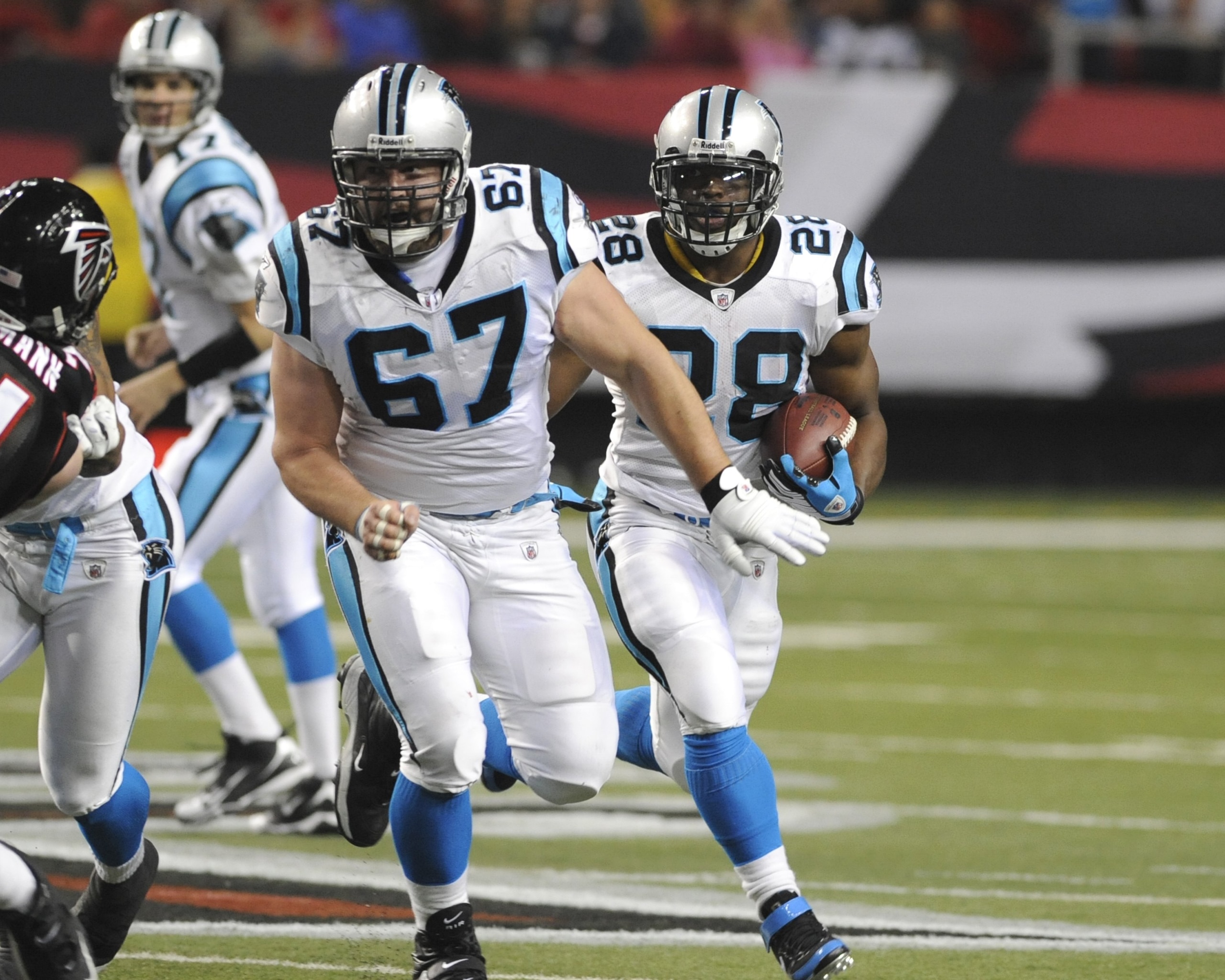 ATLANTA - NOVEMBER 23: Center Ryan Kalil #67 of the Carolina Panthers blocks for running back Jonathan Stewart #28 against the Atlanta Falcons at the Georgia Dome on November 23, 2008 in Atlanta, Georgia.  (Photo by Al Messerschmidt/Getty Images)