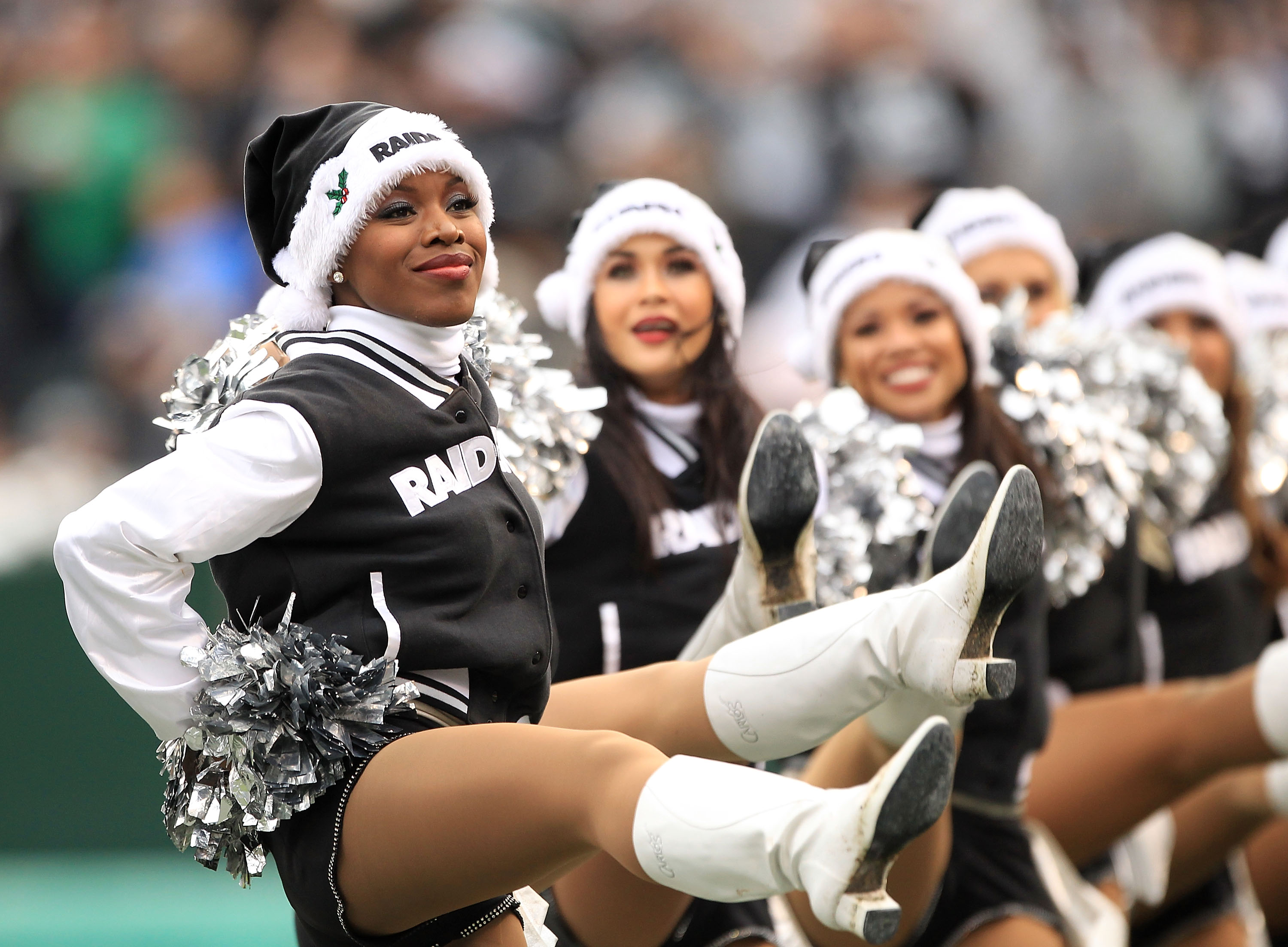 OAKLAND, CA - DECEMBER 19:  The Raiderettes cheer during the Denver Broncos game against the Oakland Raiders at Oakland-Alameda County Coliseum on December 19, 2010 in Oakland, California.  (Photo by Ezra Shaw/Getty Images)