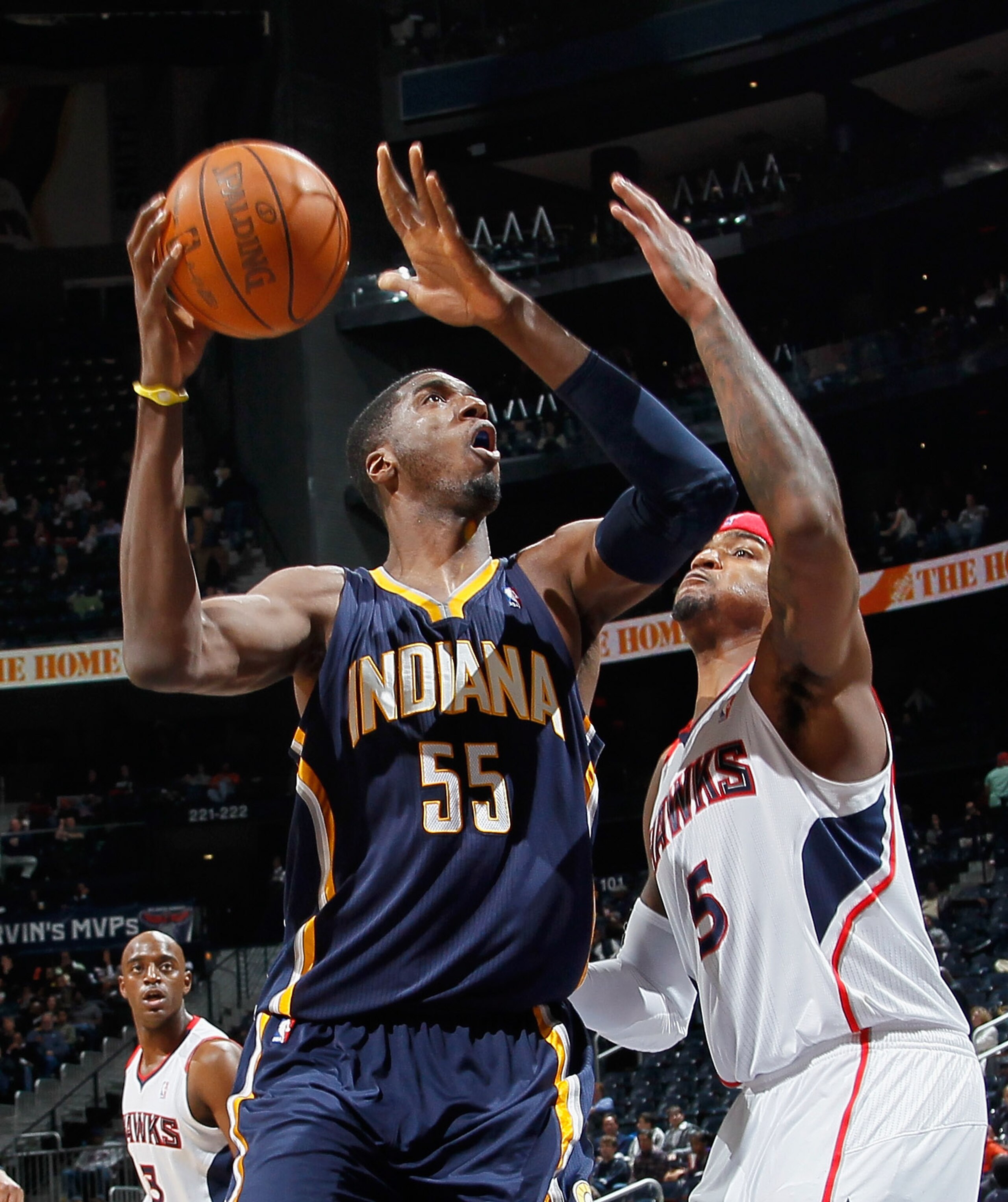 ATLANTA, GA - DECEMBER 11:  Roy Hibbert #55 of the Indiana Pacers drives against Josh Smith #5 of the Atlanta Hawks at Philips Arena on December 11, 2010 in Atlanta, Georgia.  NOTE TO USER: User expressly acknowledges and agrees that, by downloading and/o