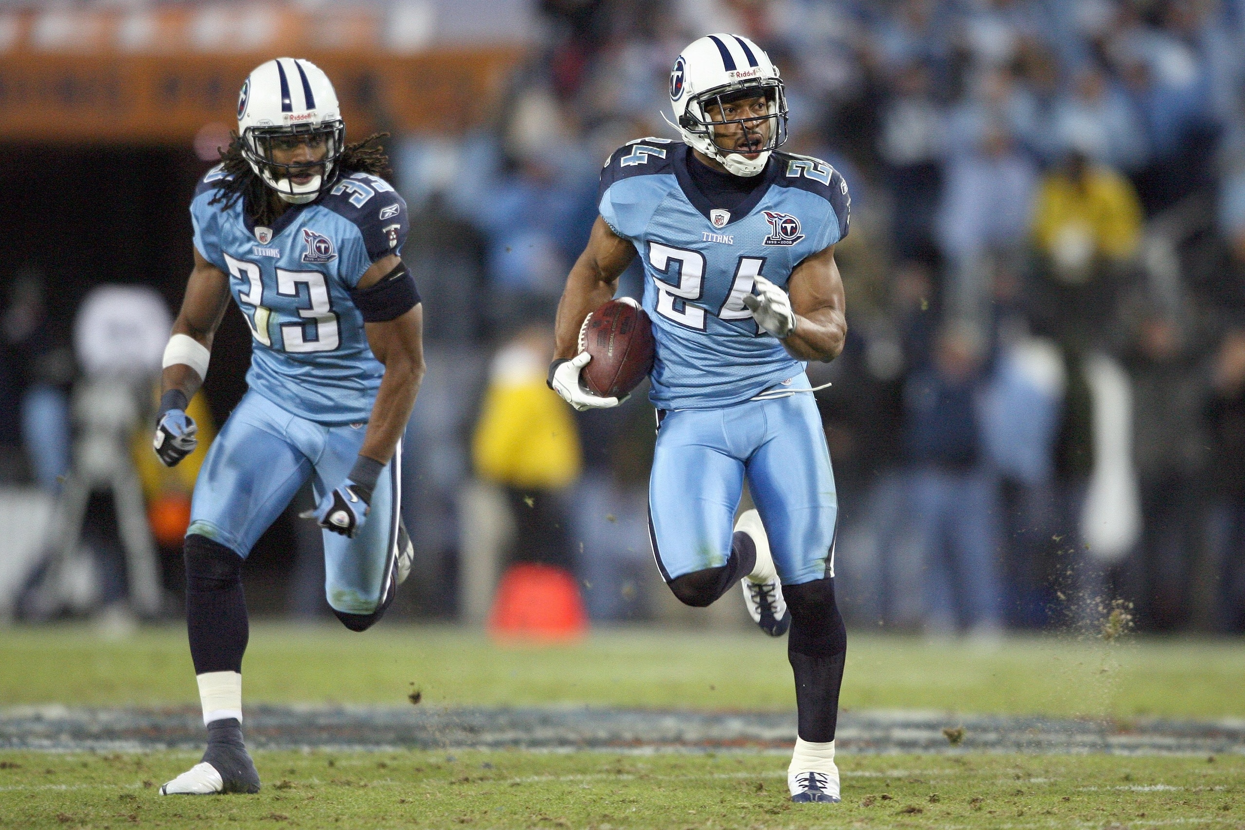 NASHVILLE, TN - OCTOBER 27:  Chris Hope #24 of the Tennessee Titans carries the ball as Michael Griffin #33 follows during the NFL game against the Indianapolis Colts at  LP Field on October 27, 2008 in Nashville, Tennessee.  (Photo by Andy Lyons/Getty Im