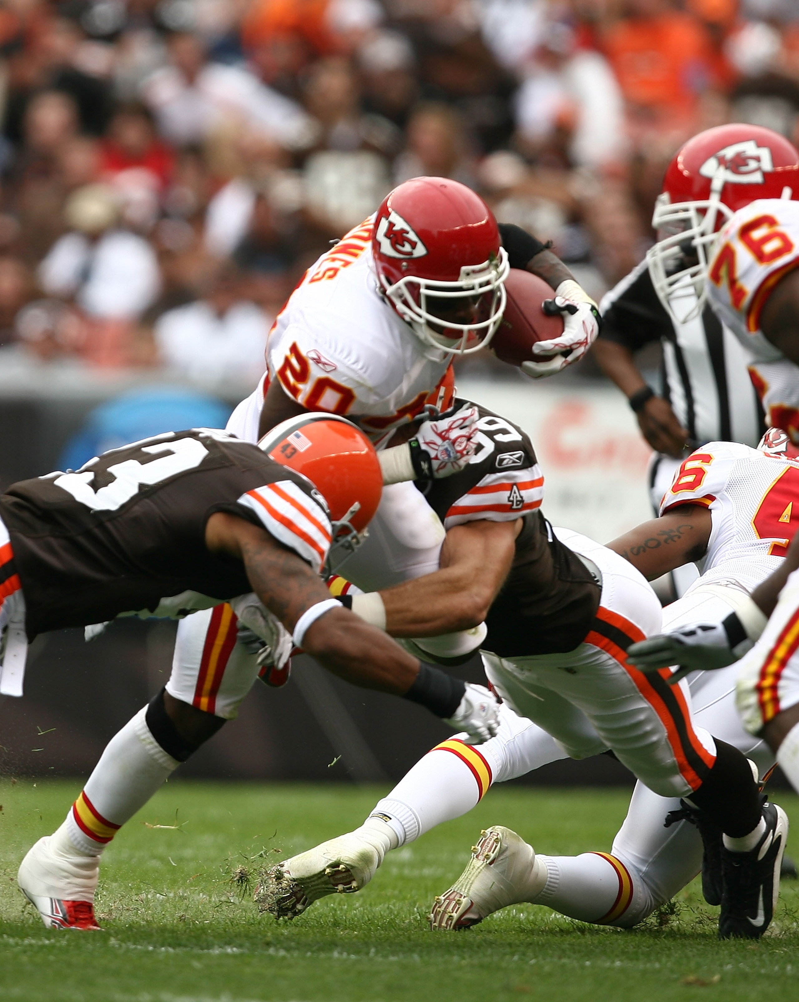 CLEVELAND - SEPTEMBER 19:  Running back Thomas Jones #20 of the Kansas City Chiefs is hit by T.J. Ward #43 of the Cleveland Browns at Cleveland Browns Stadium on September 19, 2010 in Cleveland, Ohio.  (Photo by Matt Sullivan/Getty Images)