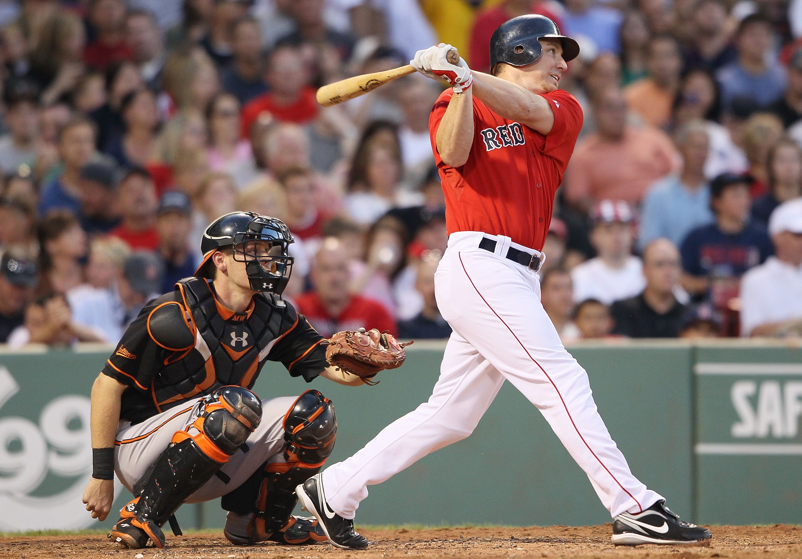 BOSTON - JULY 02:  J.D. Drew #7 of the Boston Red Sox hits a solo home run in the fifth inning as Matt Wieters #32 of the Baltimore Orioles defends on July 2, 2010 at Fenway Park in Boston, Massachusetts.  (Photo by Elsa/Getty Images)