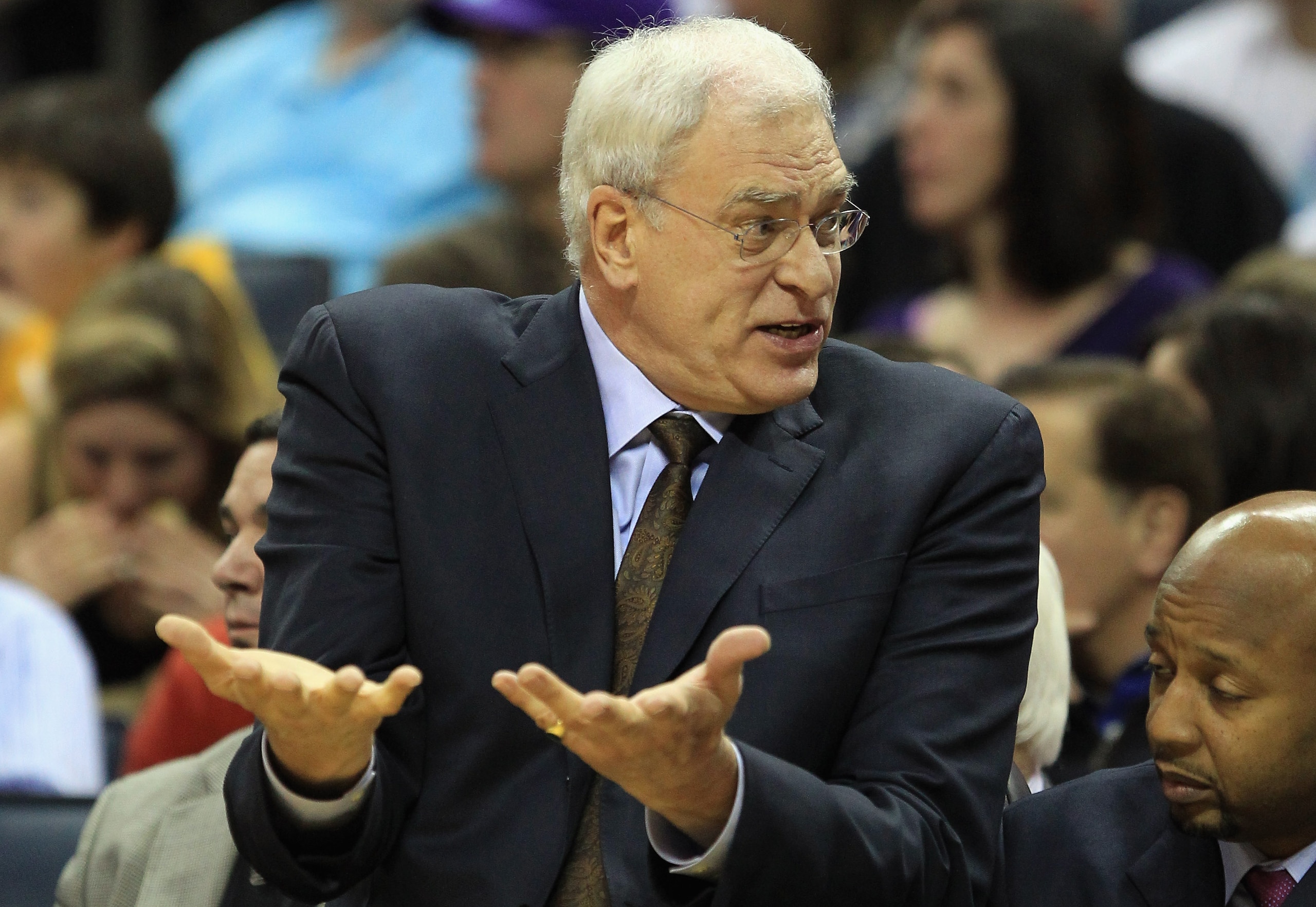 CHARLOTTE, NC - FEBRUARY 14:  Head coach Phil Jackson of the Los Angeles Lakers reacts to his bench against the Charlotte Bobcats during their game at Time Warner Cable Arena on February 14, 2011 in Charlotte, North Carolina. NOTE TO USER: User expressly