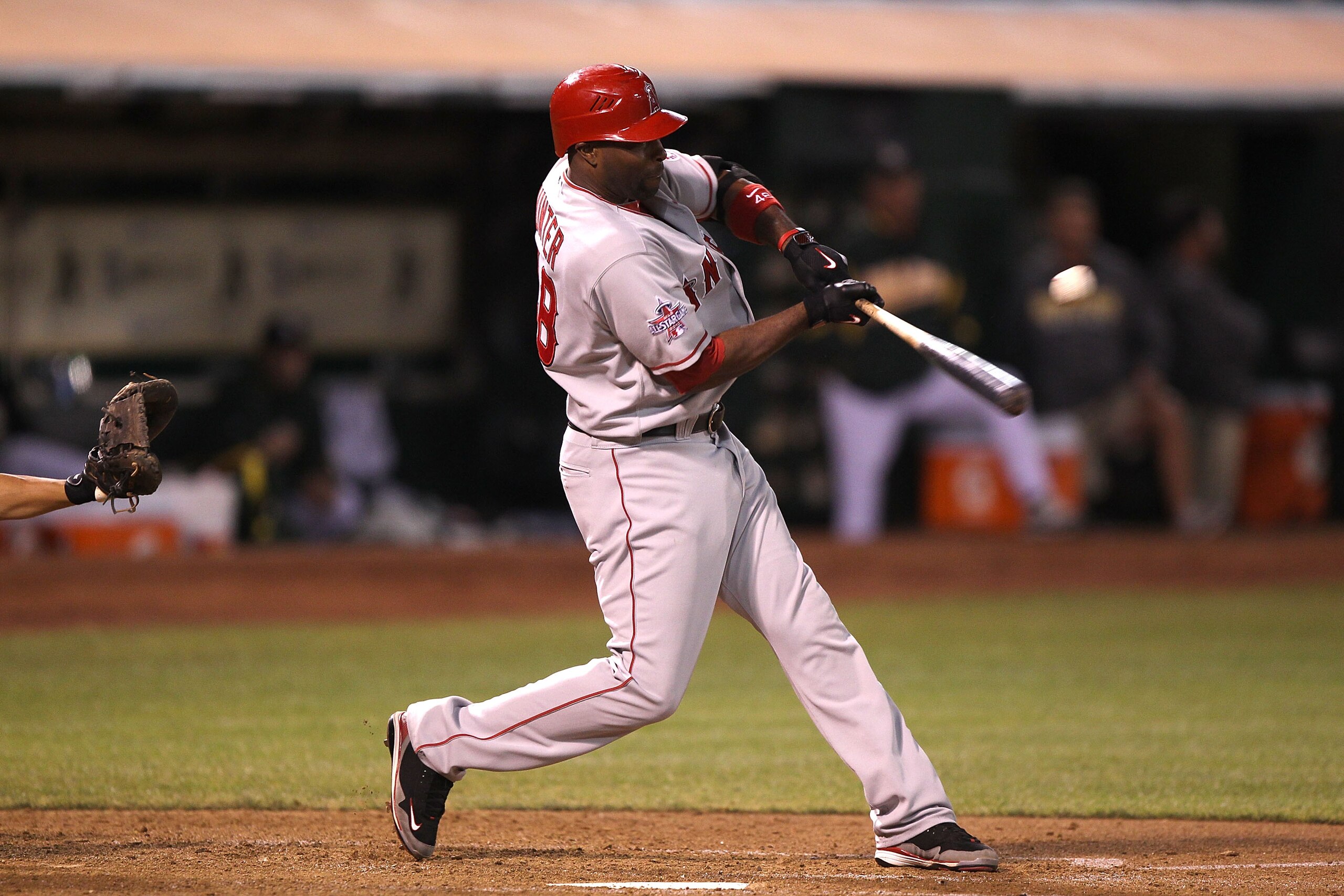 OAKLAND, CA - SEPTEMBER 3:  Torii Hunter #48 of the Los Angeles Angels of Anaheim singles in the fourth inning against the Oakland Athletics during a Major League Baseball game at the Oakland-Alameda County Coliseum on September 3, 2010 in Oakland, Califo