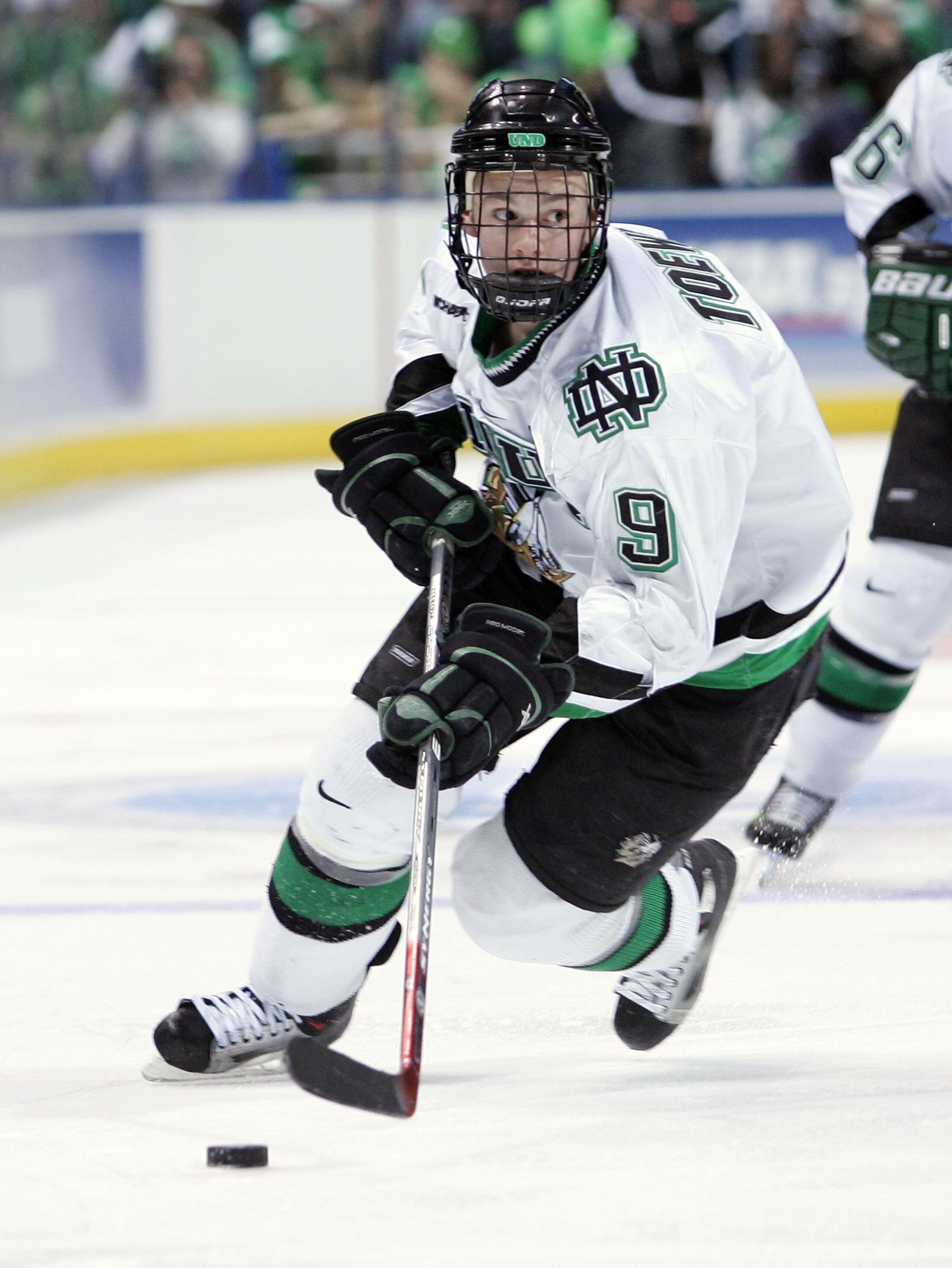 MILWAUKEE - APRIL 06:  Jonathan Toews #9 of the North Dakota Fighting Sioux moves the puck against the Boston College Eagles during the NCAA Frozen Four on April 6, 2006 at the Bradley Center in Milwaukee, Wisconsin. Boston College defeated North Dakota 6