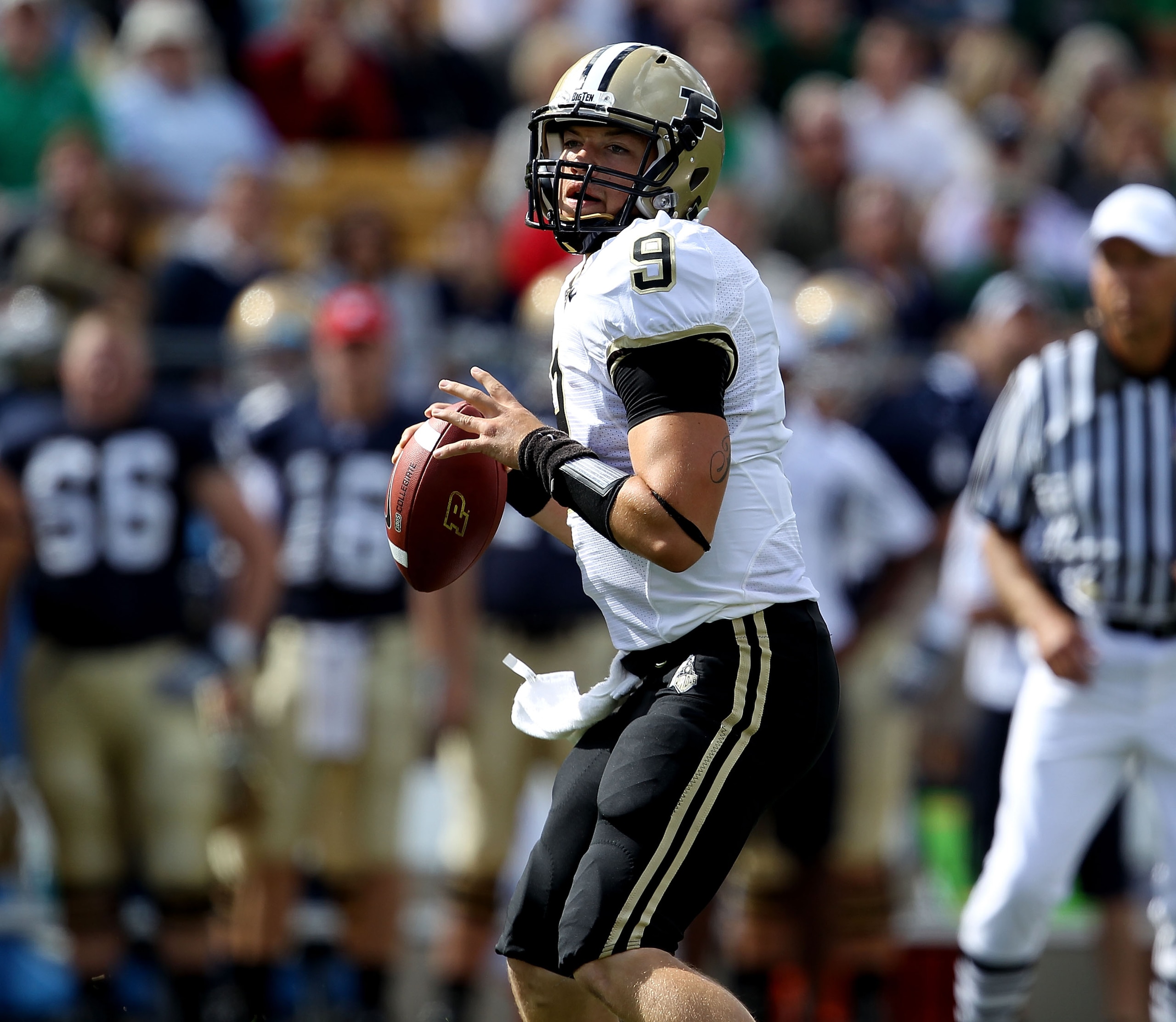 SOUTH BEND, IN - SEPTEMBER 04: Robert Marve #9 of the Purdue Boilermakers looks for a receiver against the Notre Dame Fighting Irish at Notre Dame Stadium on September 4, 2010 in South Bend, Indiana. Notre Dame defated Purdue 23-12. (Photo by Jonathan Dan