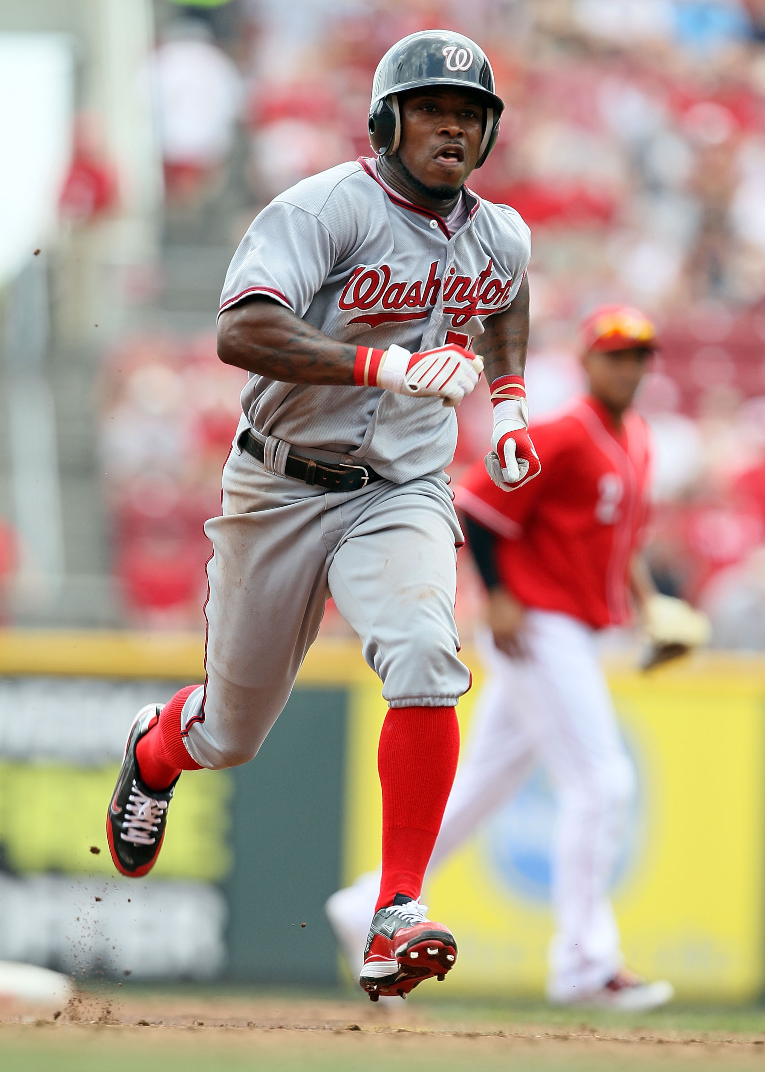 CINCINNATI - JULY 22:  Willie Harris #22 of the Washington Nationals runs to third base during the game against the Cincinnati Reds at Great American Ball Park on July 22, 2010 in Cincinnati, Ohio.  (Photo by Andy Lyons/Getty Images)
