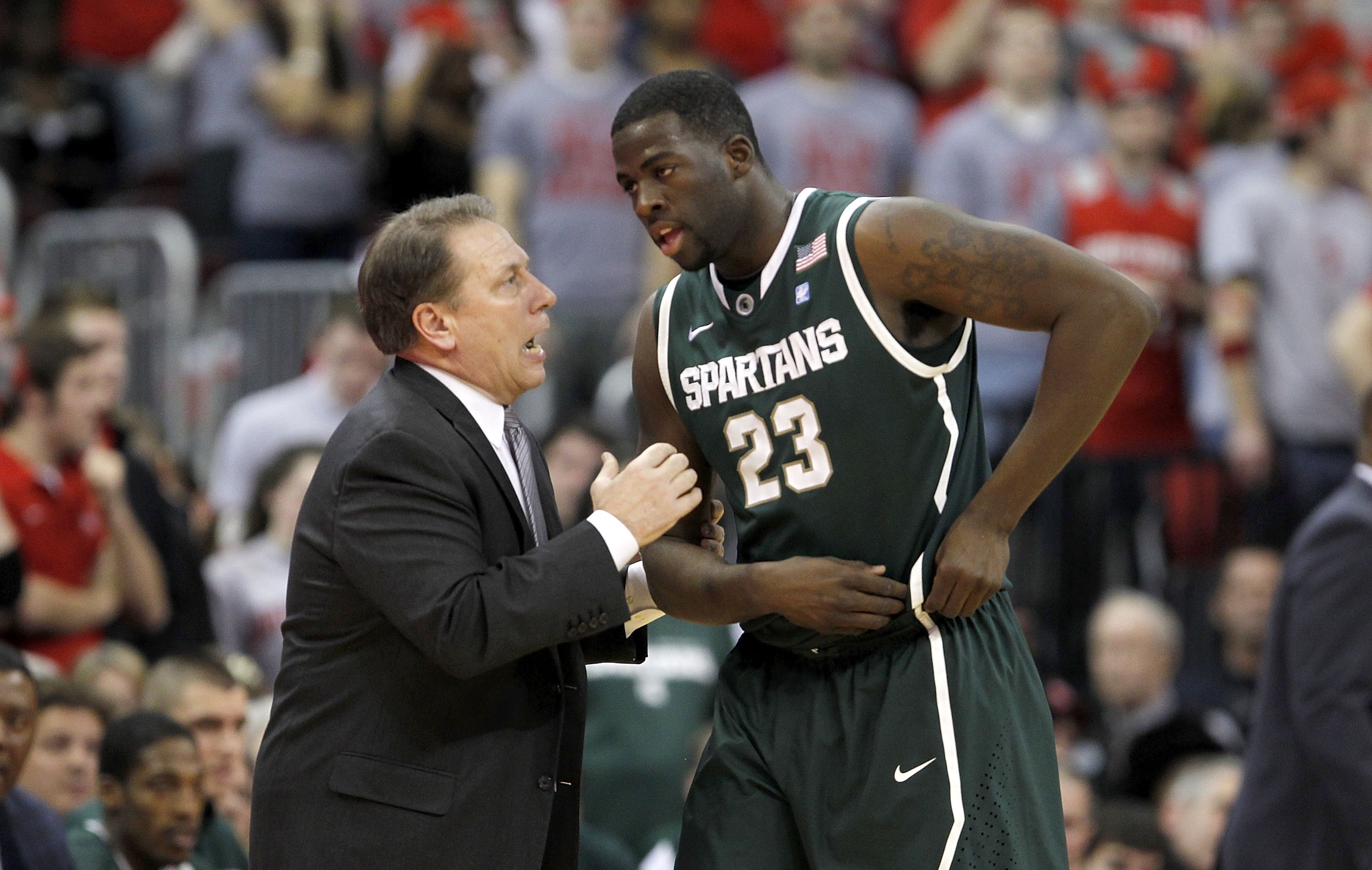 COLUMBUS, OH - FEBRUARY 15:  Head Coach Tom Izzo speaks with Draymond Green #23, both of the Michigan State Spartans, during the first half against the Ohio State Buckeyes on February 15, 2011 at Value City Arena in Columbus, Ohio.  (Photo by Gregory Sham