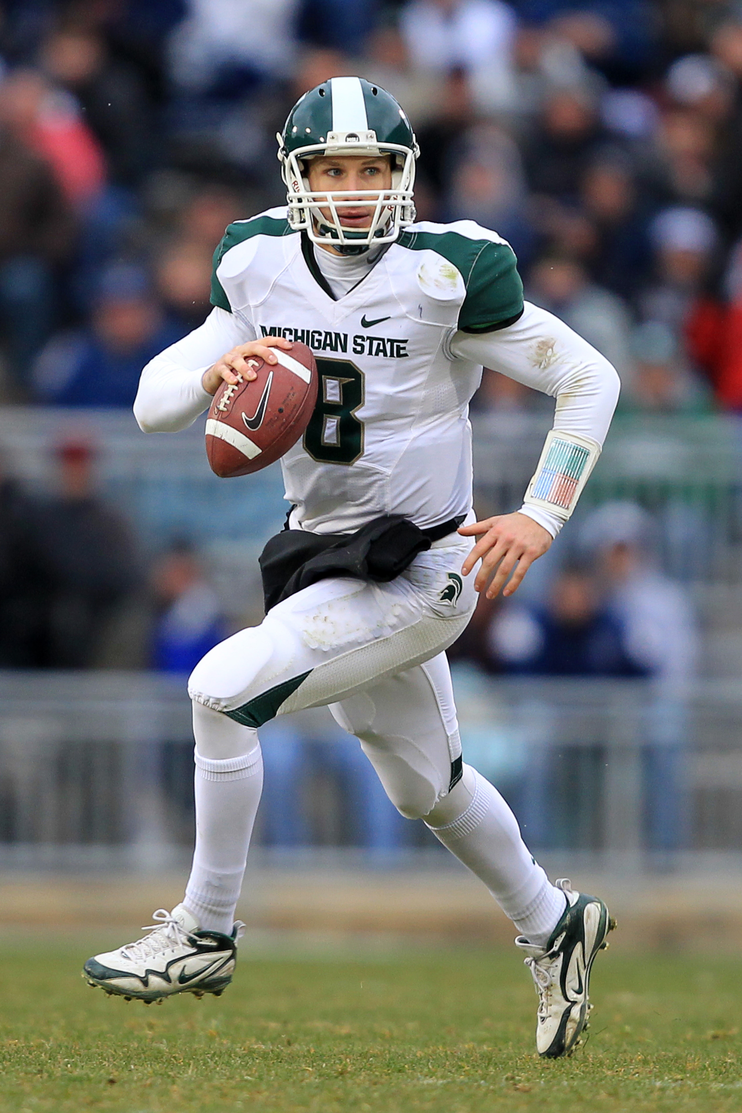 STATE COLLEGE, PA - NOVEMBER 27: Quarterback Kirk Cousins #8 of the Michigan State Spartans scrambles out of the pocket during a game against the Penn State Nittany Lions on November 27, 2010 at Beaver Stadium in State College, Pennsylvania. The Spartans