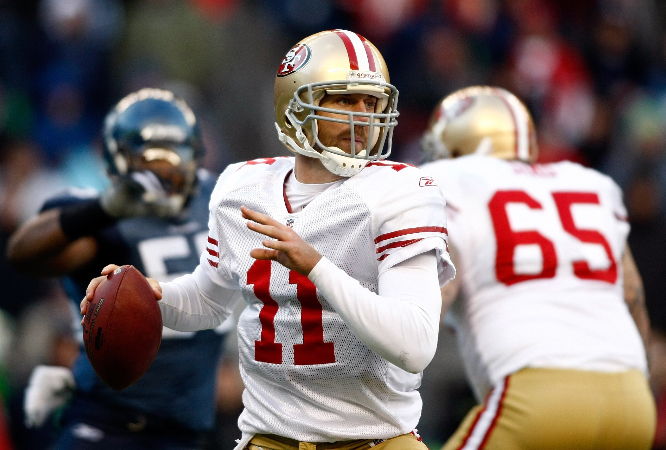 SEATTLE , WA - DECEMBER 06:  Quarterback Alex Smith #11 of the San Francisco 49ers throws the ball against the Seattle Seahawks  at Qwest Field on December 6, 2009 in Seattle, Washington.  (Photo by Jonathan Ferrey/Getty Images)