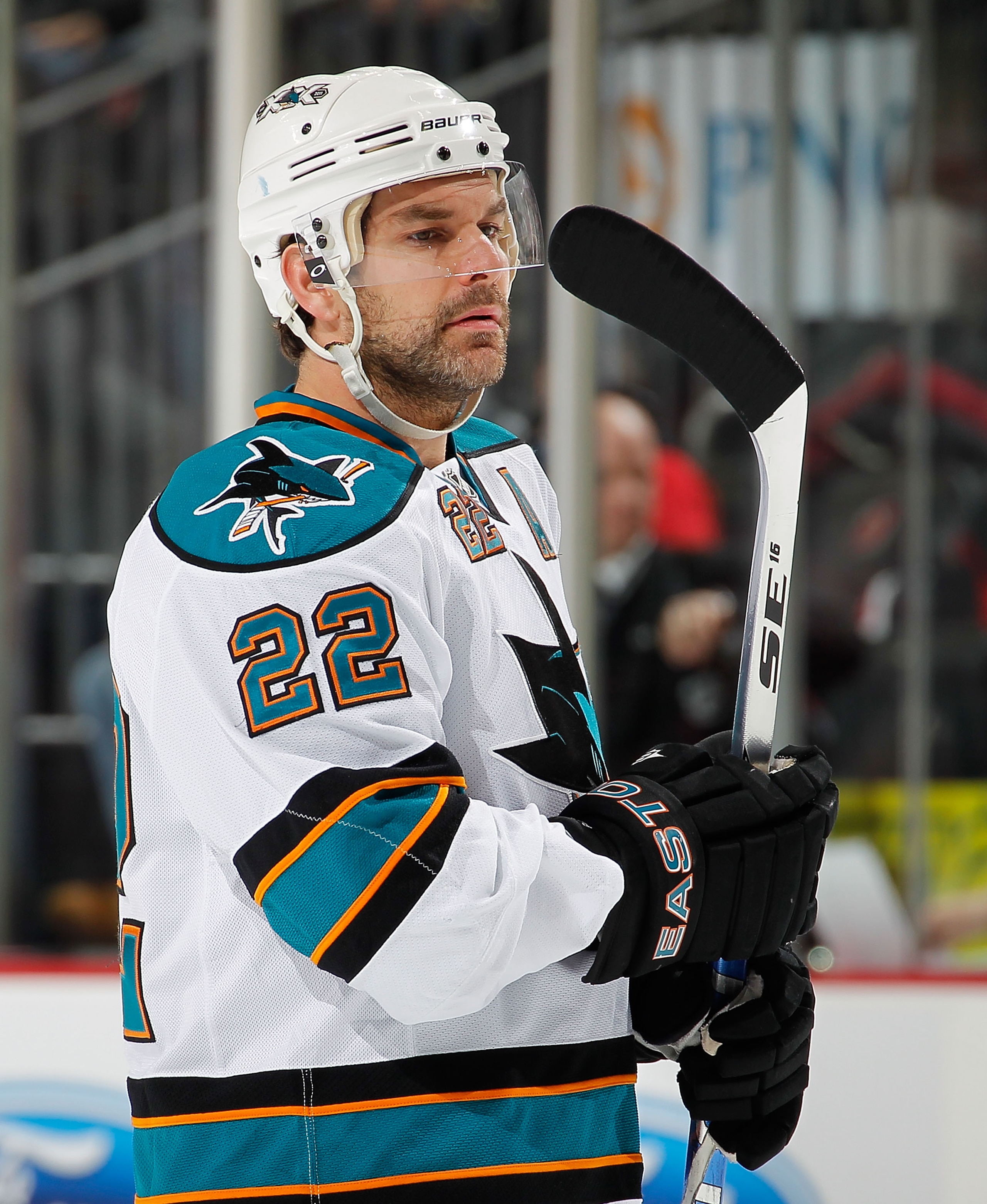 NEWARK, NJ - FEBRUARY 11: Dan Boyle #22 of the San Jose Sharks checks his stick while waiting for a faceoff during an NHL hockey game against the New Jersey Devils on February 11, 2011 at the Prudential Center in Newark, New Jersey. (Photo by Paul Bereswi