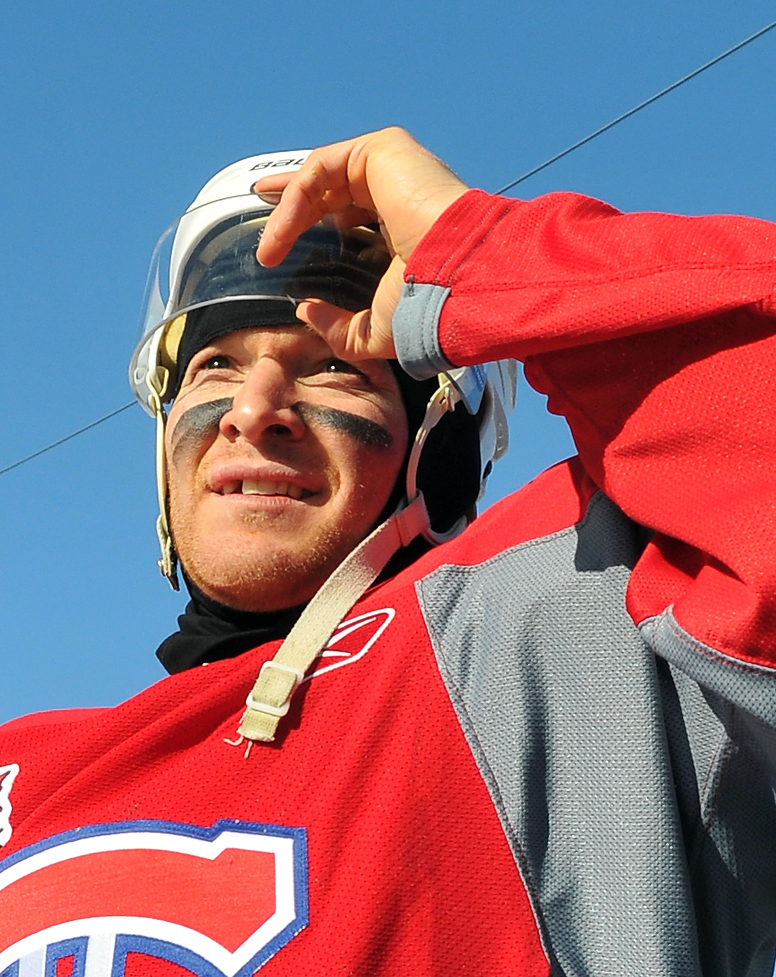 CALGARY, AB - FEBRUARY 19: Jeff Halpern #15 of the Montreal Canadiens walks out for the practice session the day before the 2011 NHL Heritage Classic at McMahon Stadium on February 19, 2011 in Calgary, Canada.  (Photo by Dylan Lynch/Getty Images)