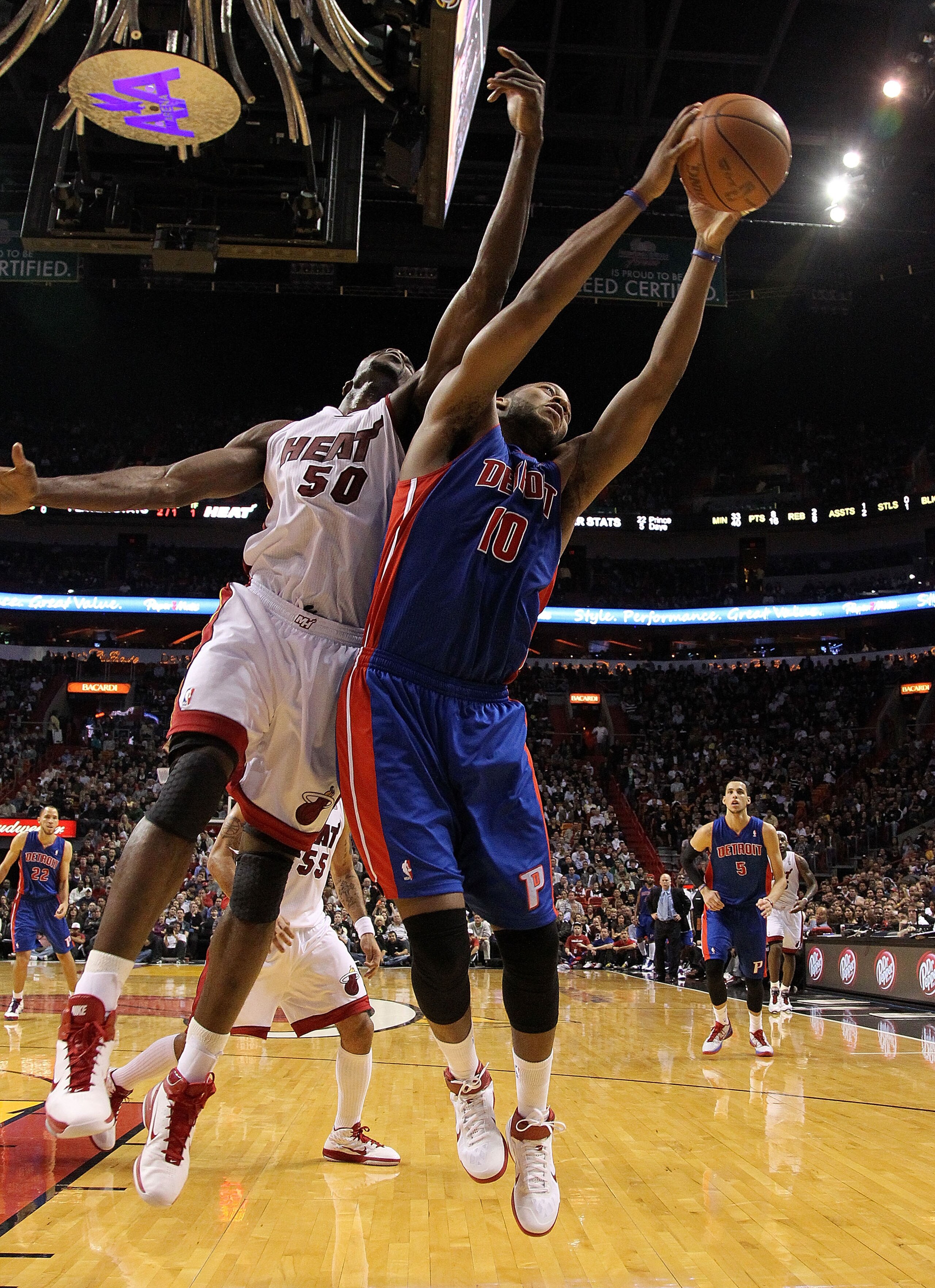 MIAMI, FL - JANUARY 28: Greg Monroe #10 of of the Detroit Pistons fights for a rebound against Joel Anthony #50 of the Miami Heat during a game at American Airlines Arena on January 28, 2011 in Miami, Florida. NOTE TO USER: User expressly acknowledges an MIAMI, FL - JANUARY 28: Greg Monroe #10 of of the Detroit Pistons fights for a rebound against Joel Anthony #50 of the Miami Heat during a game at American Airlines Arena on January 28, 2011 in Miami, Florida. NOTE TO USER: User expressly acknowledges an