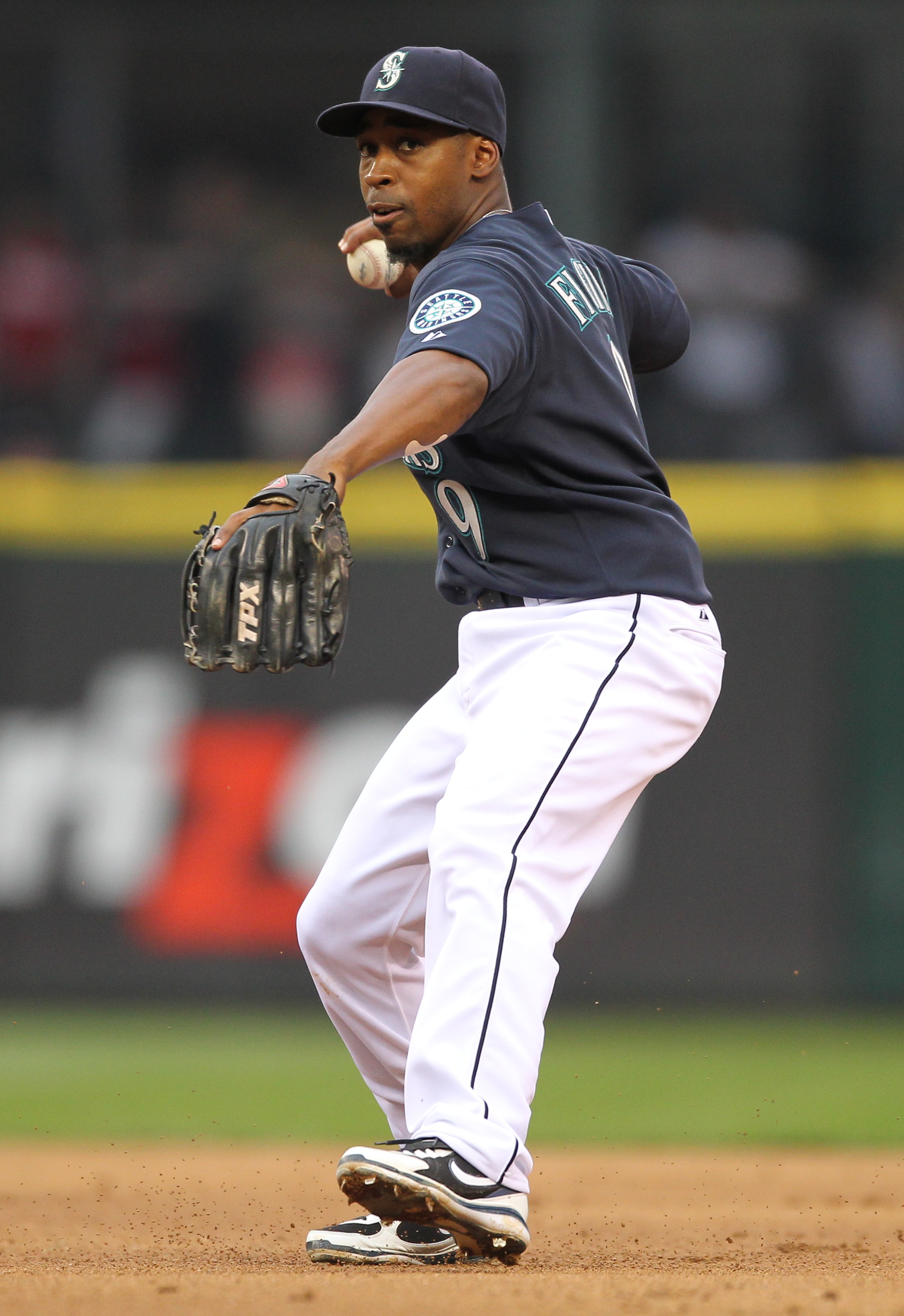 SEATTLE - JULY 09: Second baseman Chone Figgins #9 of the Seattle Mariners throws to first against the New York Yankees at Safeco Field on July 9, 2010 in Seattle, Washington. (Photo by Otto Greule Jr/Getty Images)