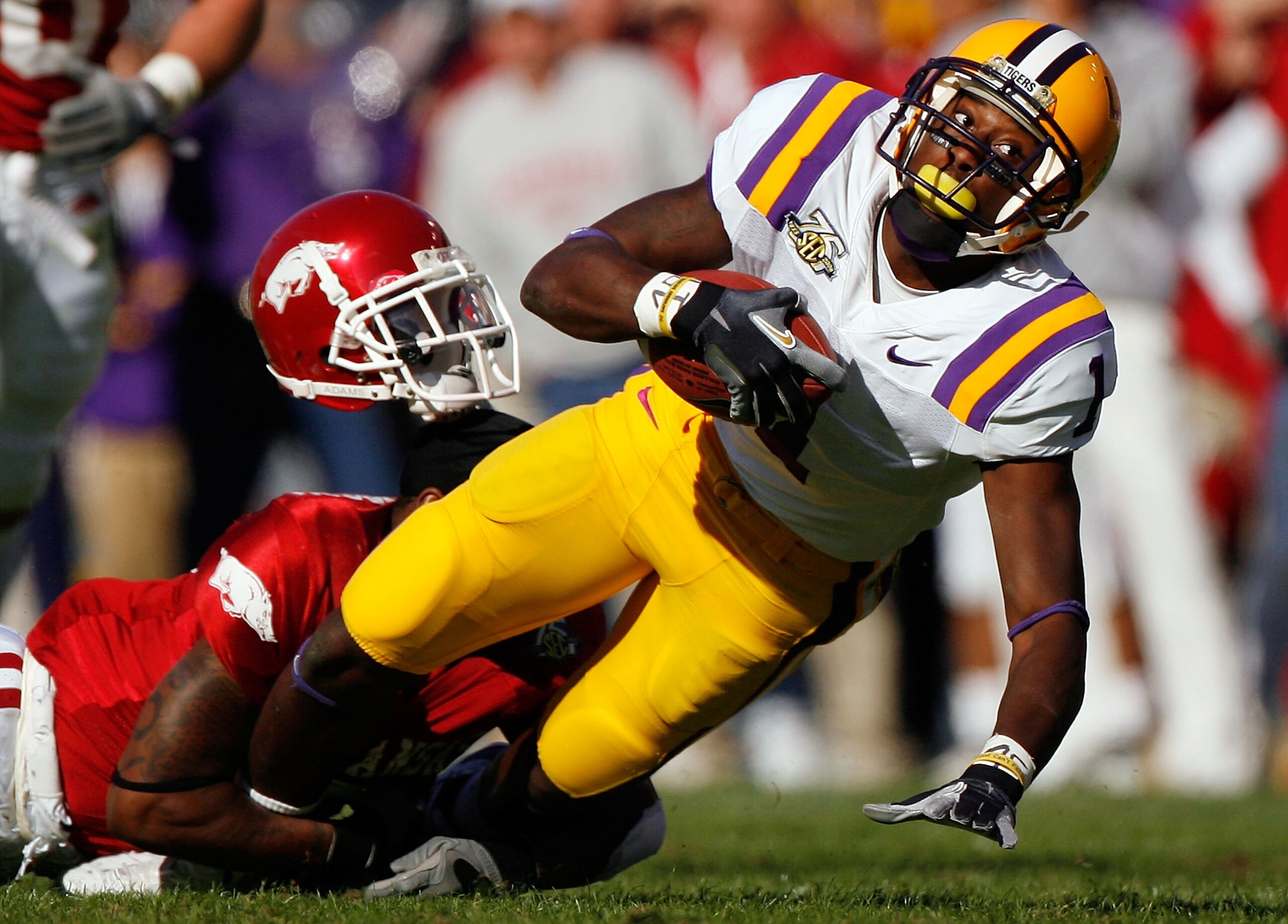 BATON ROUGE, LA - NOVEMBER 23:  Brandon LaFell #1 of the Louisiana State University Tigers is tackled by Matterral Richardson #9 of the Arkansas Razorbacks on November 23, 2007 at Tiger Stadium in Baton Rouge, Louisiana.  (Photo by Chris Graythen/Getty Im