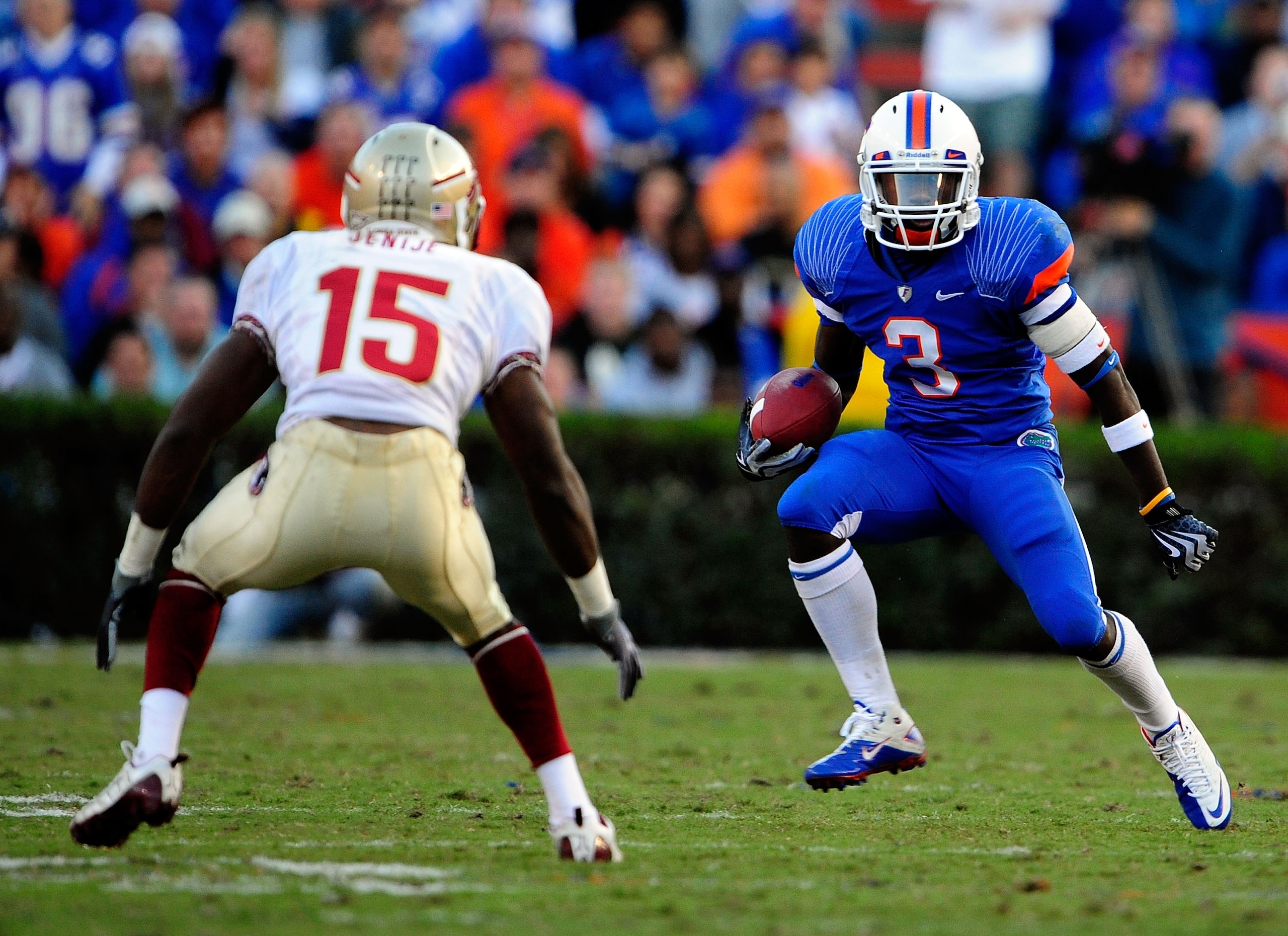 GAINESVILLE, FL - NOVEMBER 28:  Chris Rainey #3 of the Florida Gators attempts to run past Ochuko Jenije #15 of the Florida State Seminoles at Ben Hill Griffin Stadium on November 28, 2009 in Gainesville, Florida.  (Photo by Sam Greenwood/Getty Images)