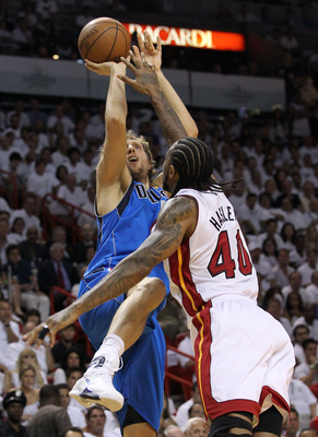 MIAMI, FL - JUNE 12:  Dirk Nowitzki #41 of the Dallas Mavericks attempts a shot against Udonis Haslem #40 of the Miami Heat in Game Six of the 2011 NBA Finals at American Airlines Arena on June 12, 2011 in Miami, Florida. NOTE TO USER: User expressly ackn